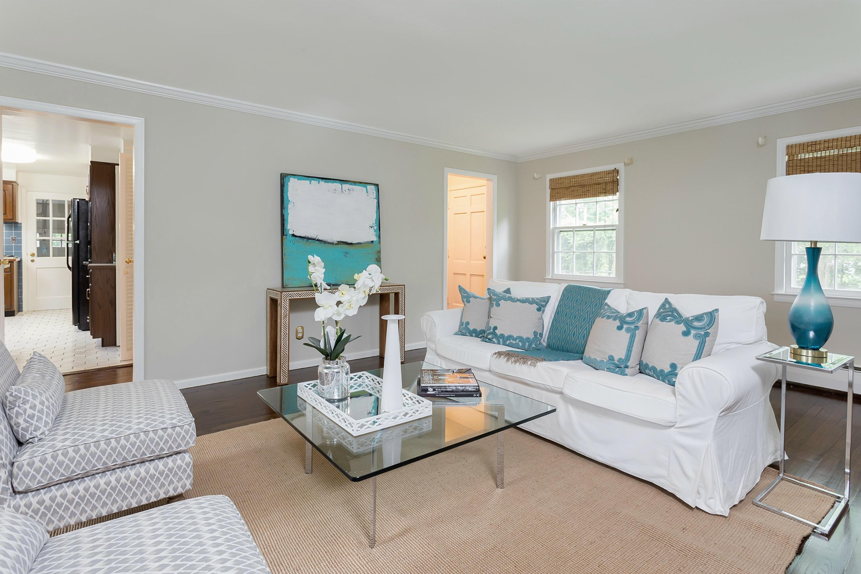 276 Smith Ridge Road New Canaan, CT 06840 - Photo 4 of 23 a living room with furniture and a table
