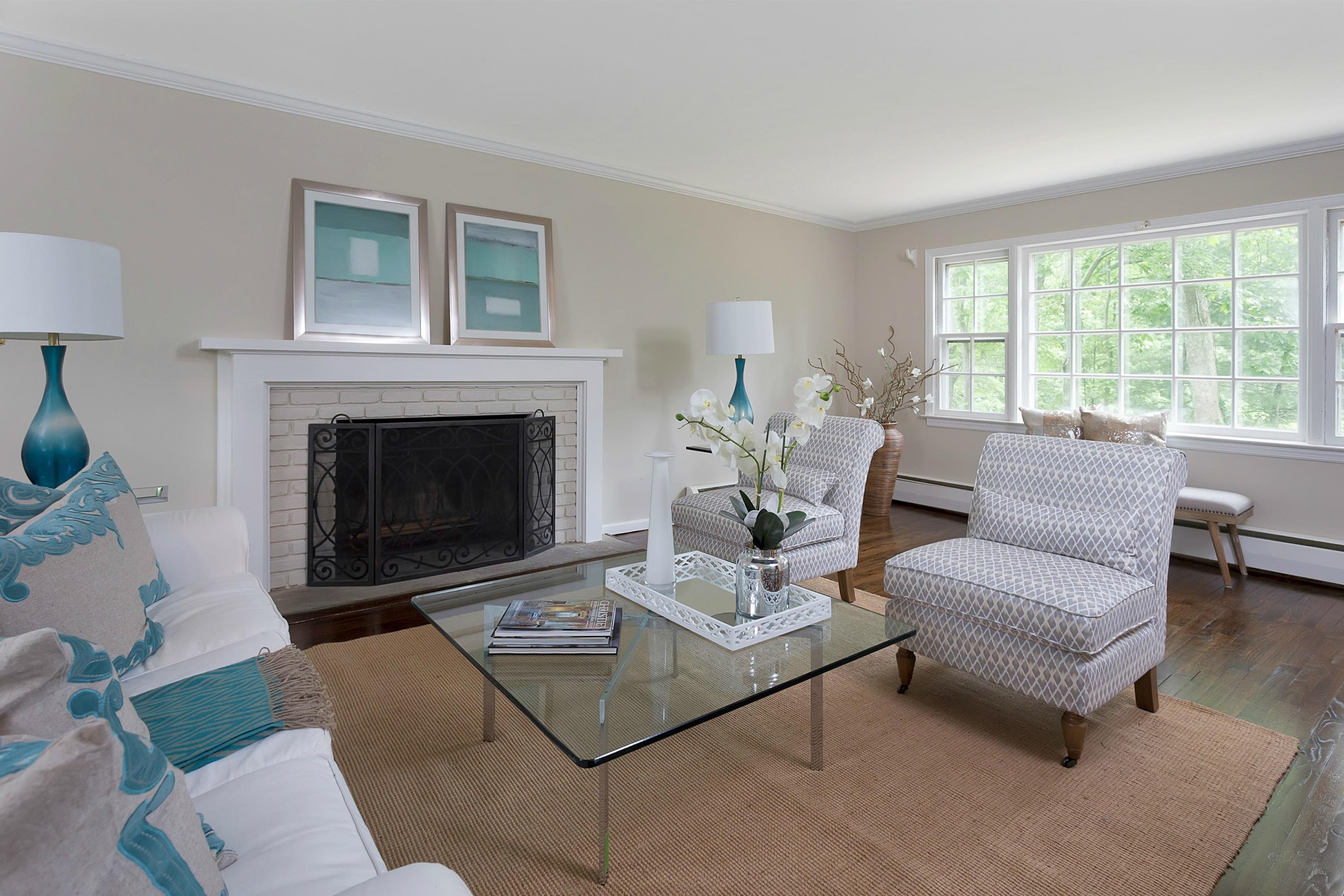 276 Smith Ridge Road New Canaan, CT 06840 - Photo 5 of 23 a living room with furniture a rug a fireplace and a window