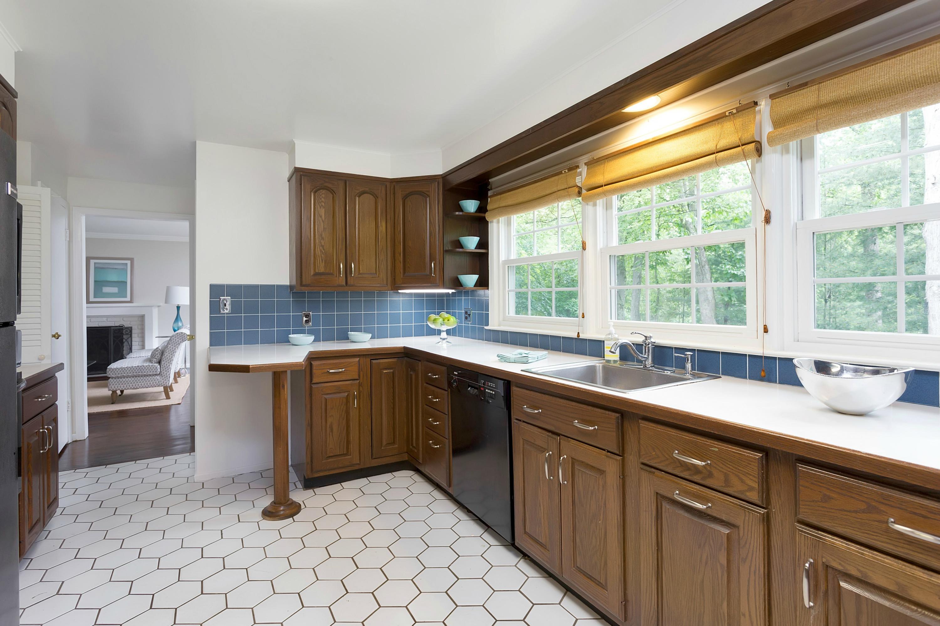 276 Smith Ridge Road New Canaan, CT 06840 - Photo 9 of 23 a kitchen with a sink and a stove top oven
