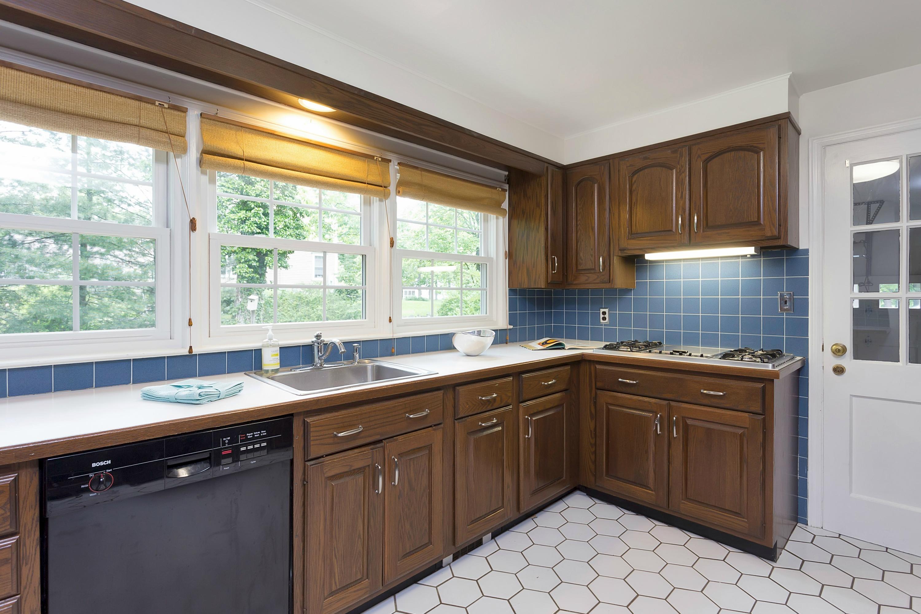 276 Smith Ridge Road New Canaan, CT 06840 - Photo 10 of 23 a kitchen with a sink stove and cabinets