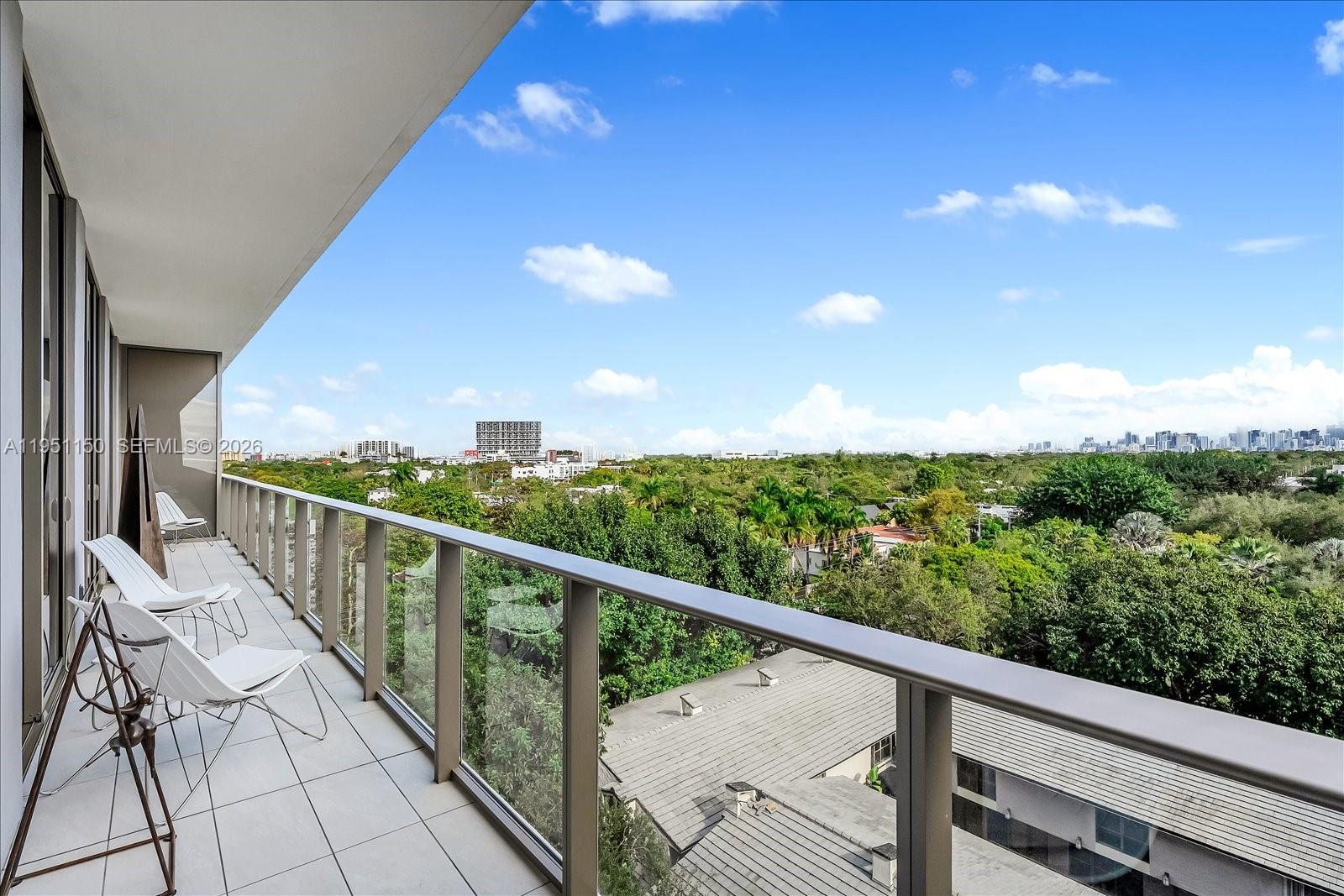 2678 Tigertail Avenue, Unit 604 Miami, FL 33133 - Photo 14 of 25 a view of a balcony with an outdoor seating