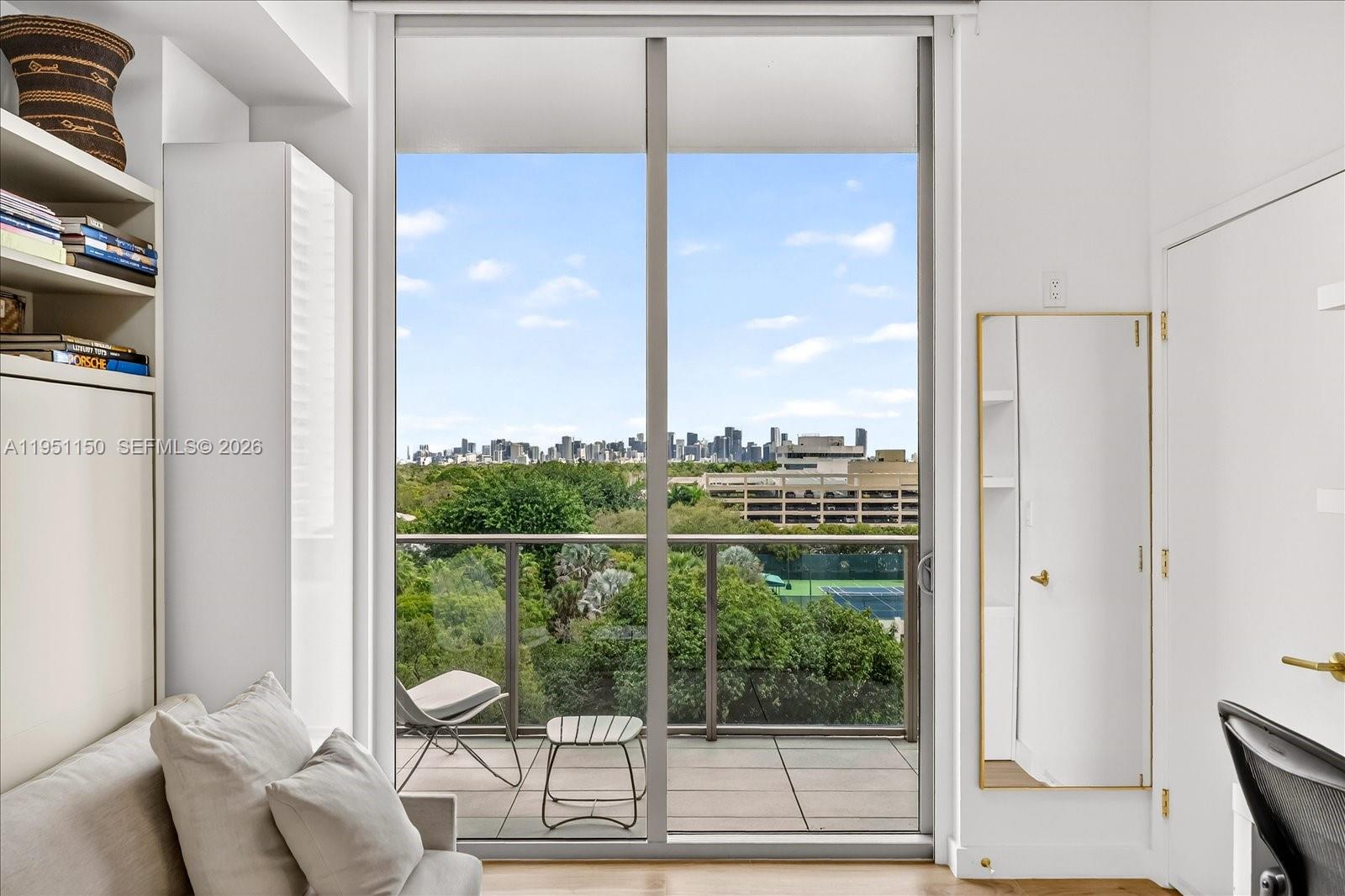 2678 Tigertail Avenue, Unit 604 Miami, FL 33133 - Photo 8 of 25 a view of a balcony with furniture