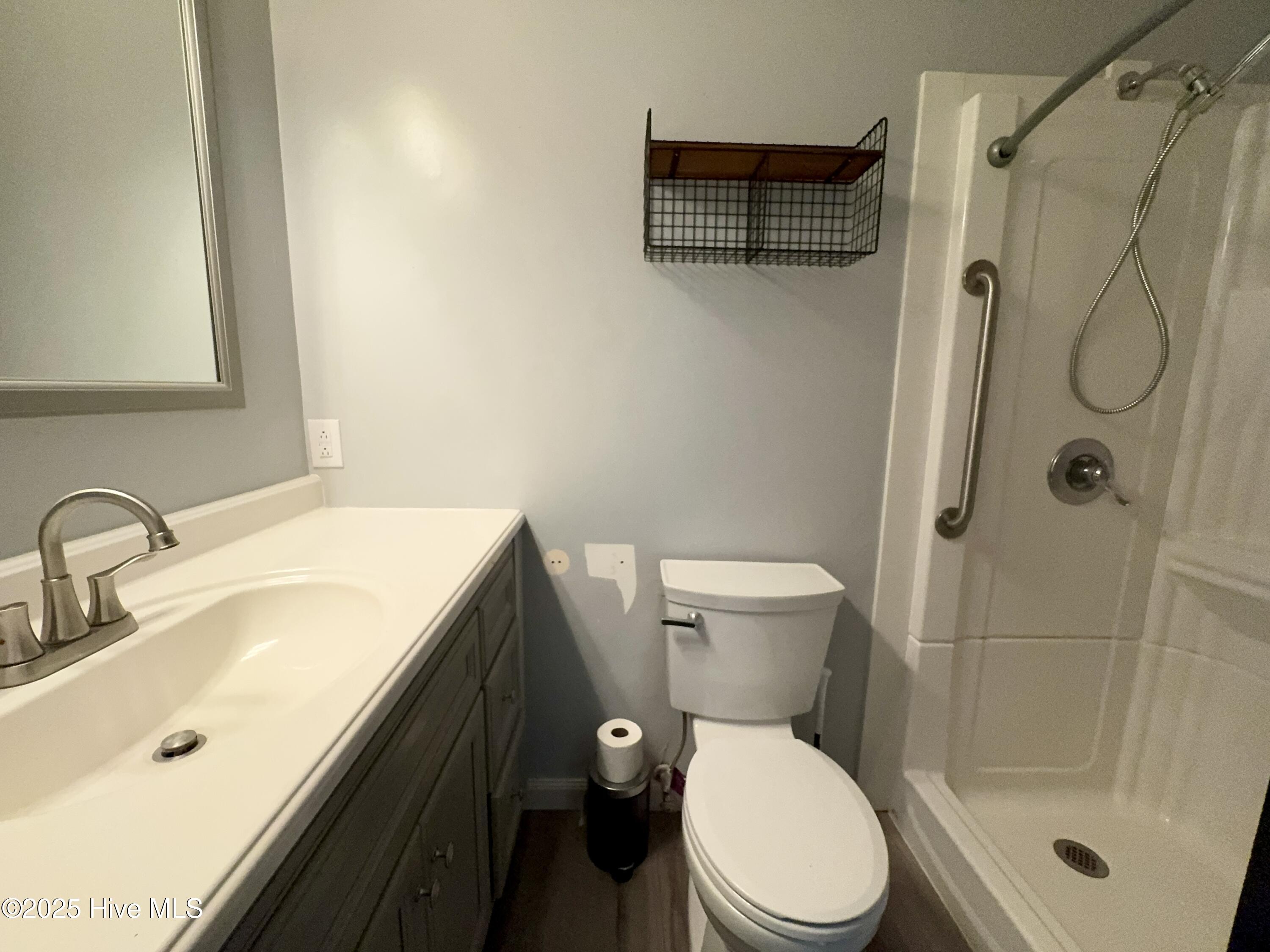 2001 Savin Road Elizabeth City, NC 27909 - Photo 12 of 31 Hallway bathroom with large vanity and walk in shower