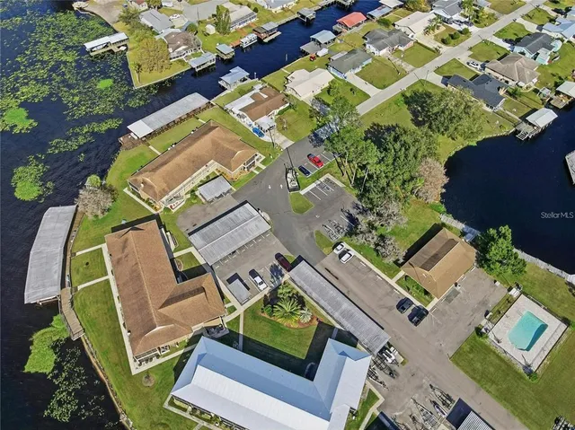 an aerial view of residential houses with outdoor space