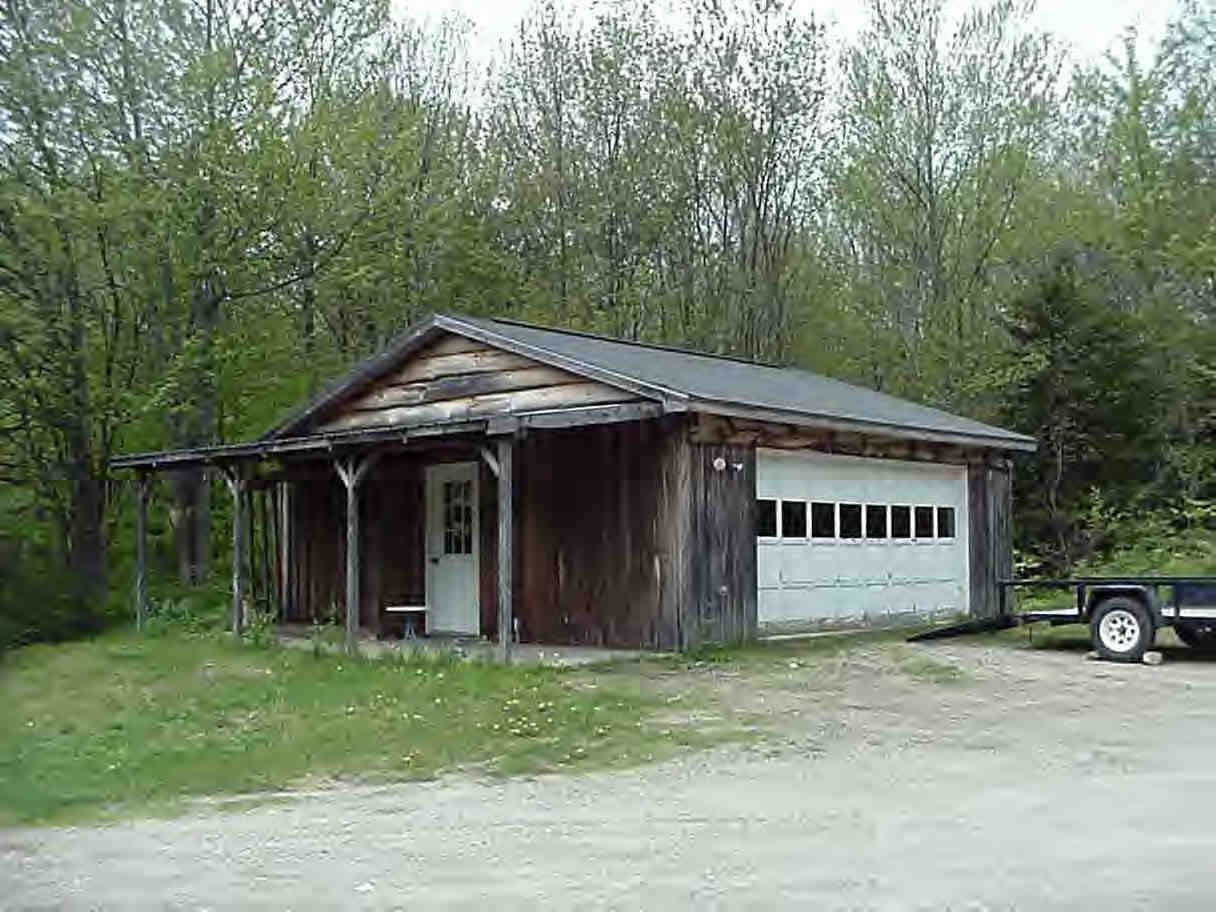 100 East Windsor Road Peru, MA 01235 - Photo 3 of 3 a view of a house with a yard and garage