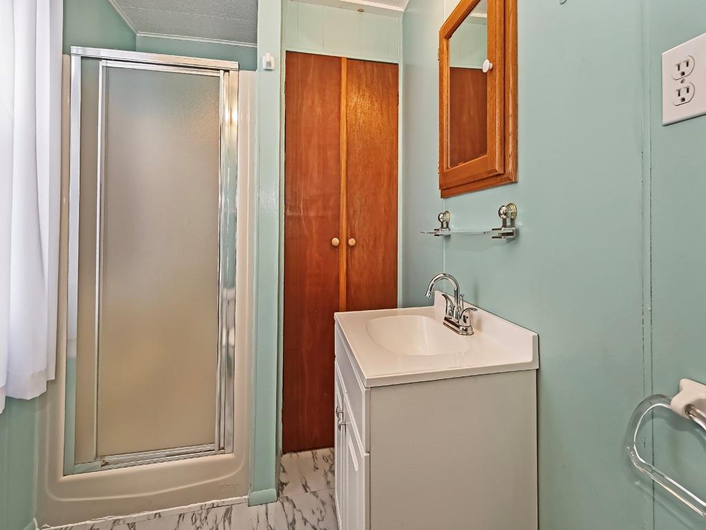 127 Lily Street Apollo, PA 15613 - Photo 14 of 27 a bathroom with a sink a toilet and shower