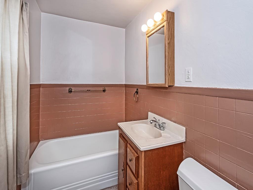 127 Lily Street Apollo, PA 15613 - Photo 21 of 27 a bathroom with a bathtub sink vanity and toilet