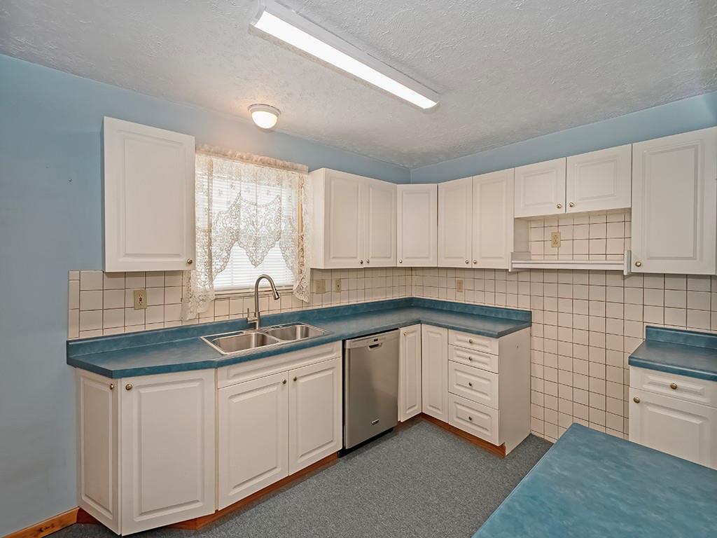 127 Lily Street Apollo, PA 15613 - Photo 9 of 27 a kitchen with sink cabinets and window