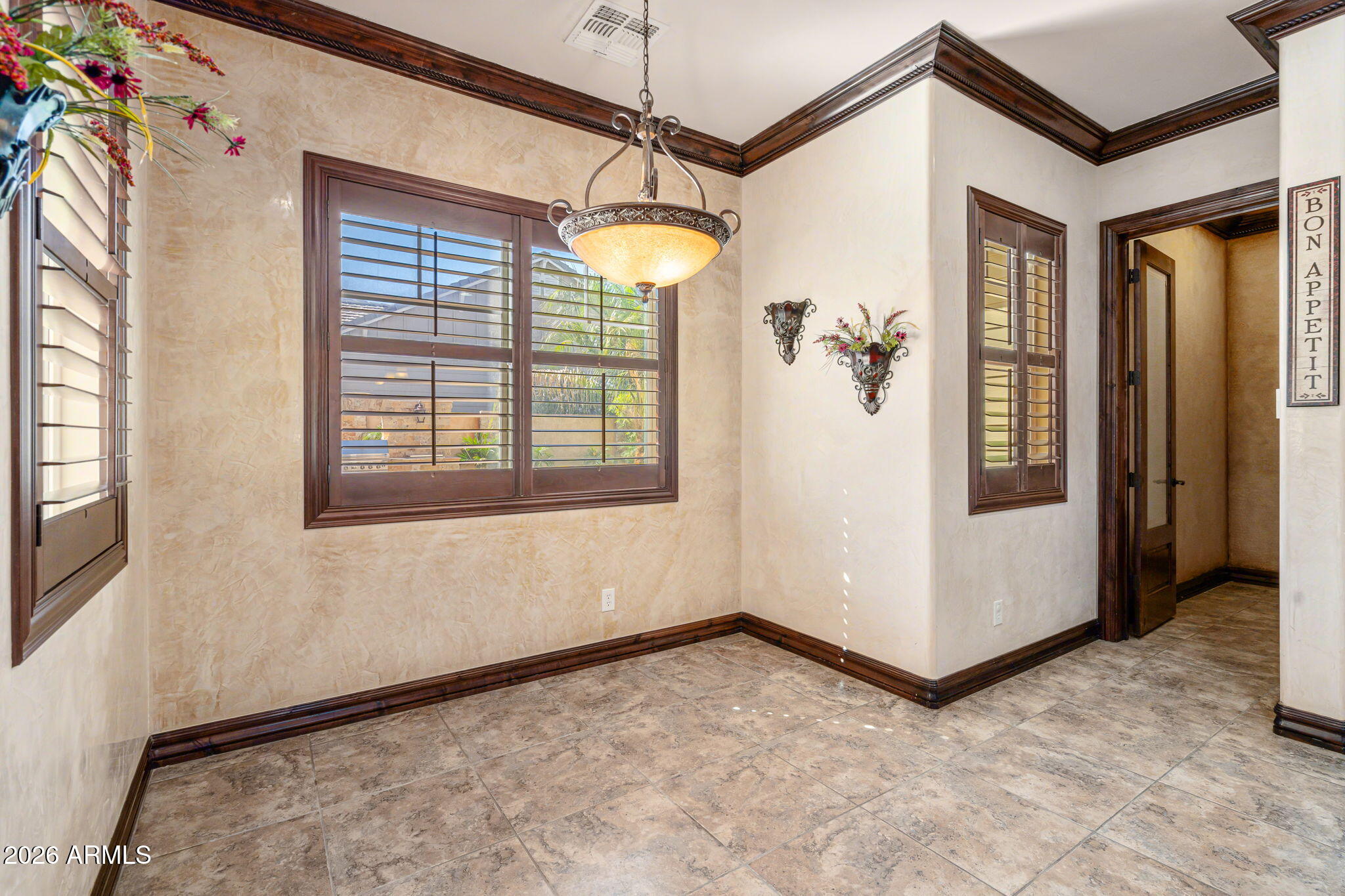 2822 East Constance Way Phoenix, AZ 85042 - Photo 19 of 64 a view of a room with a windows and ceiling fan