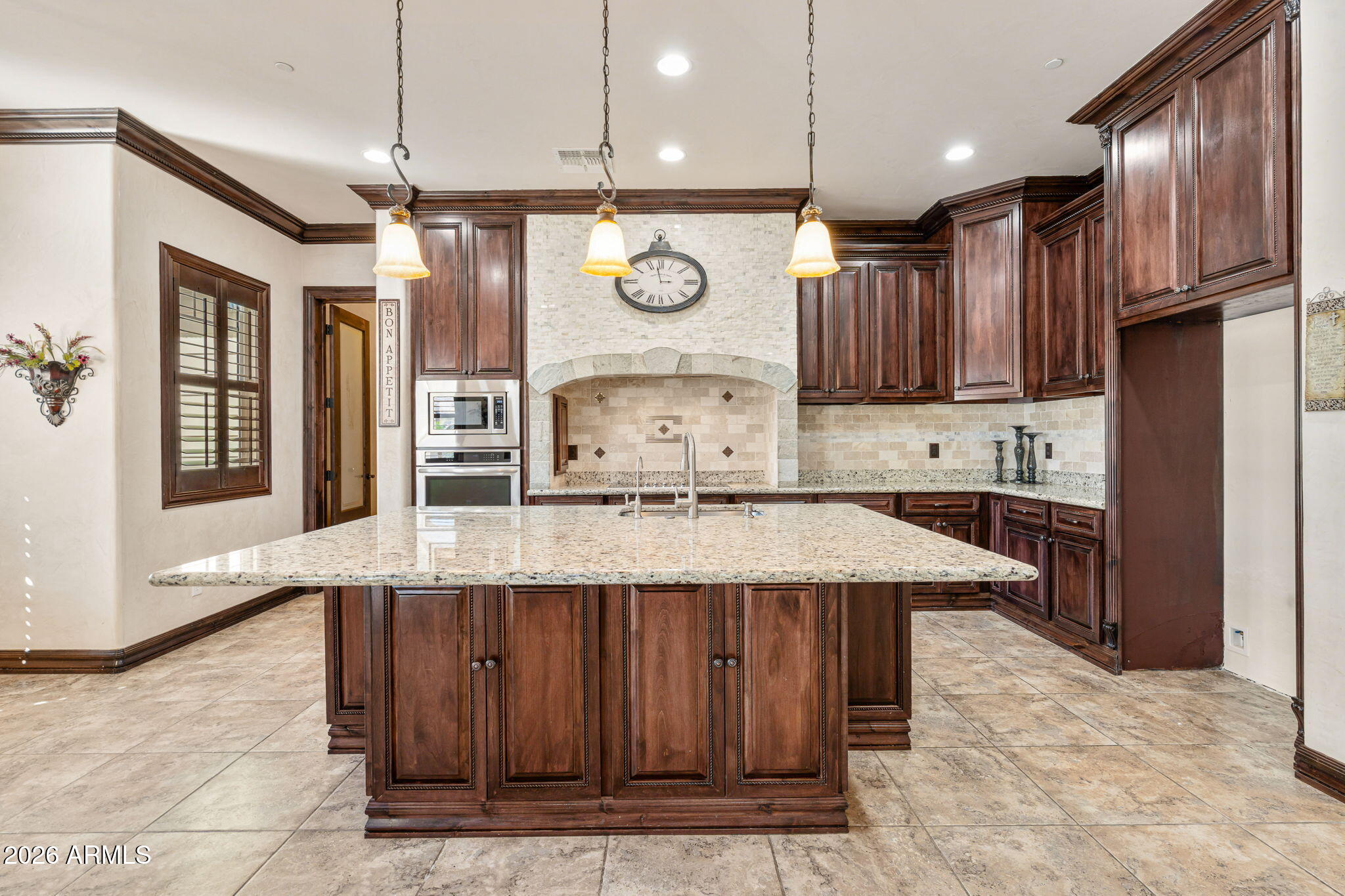 2822 East Constance Way Phoenix, AZ 85042 - Photo 21 of 64 a kitchen with stainless steel appliances granite countertop a sink a stove and a refrigerator