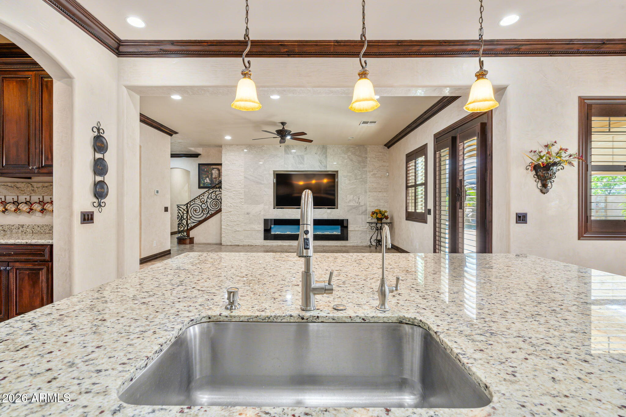 2822 East Constance Way Phoenix, AZ 85042 - Photo 24 of 64 a kitchen with a sink a counter top space cabinets and stainless steel appliances