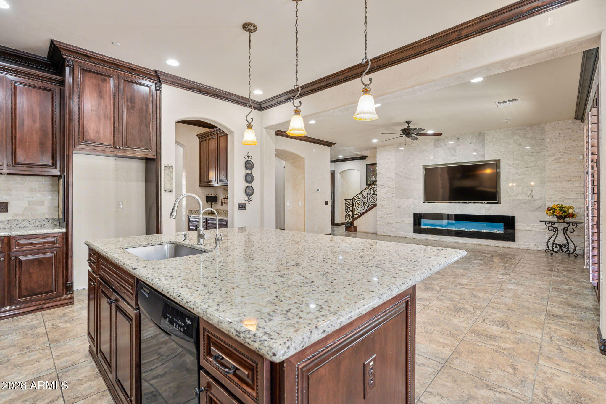2822 East Constance Way Phoenix, AZ 85042 - Photo 26 of 64 a kitchen with stainless steel appliances granite countertop a sink a oven and a wooden floor