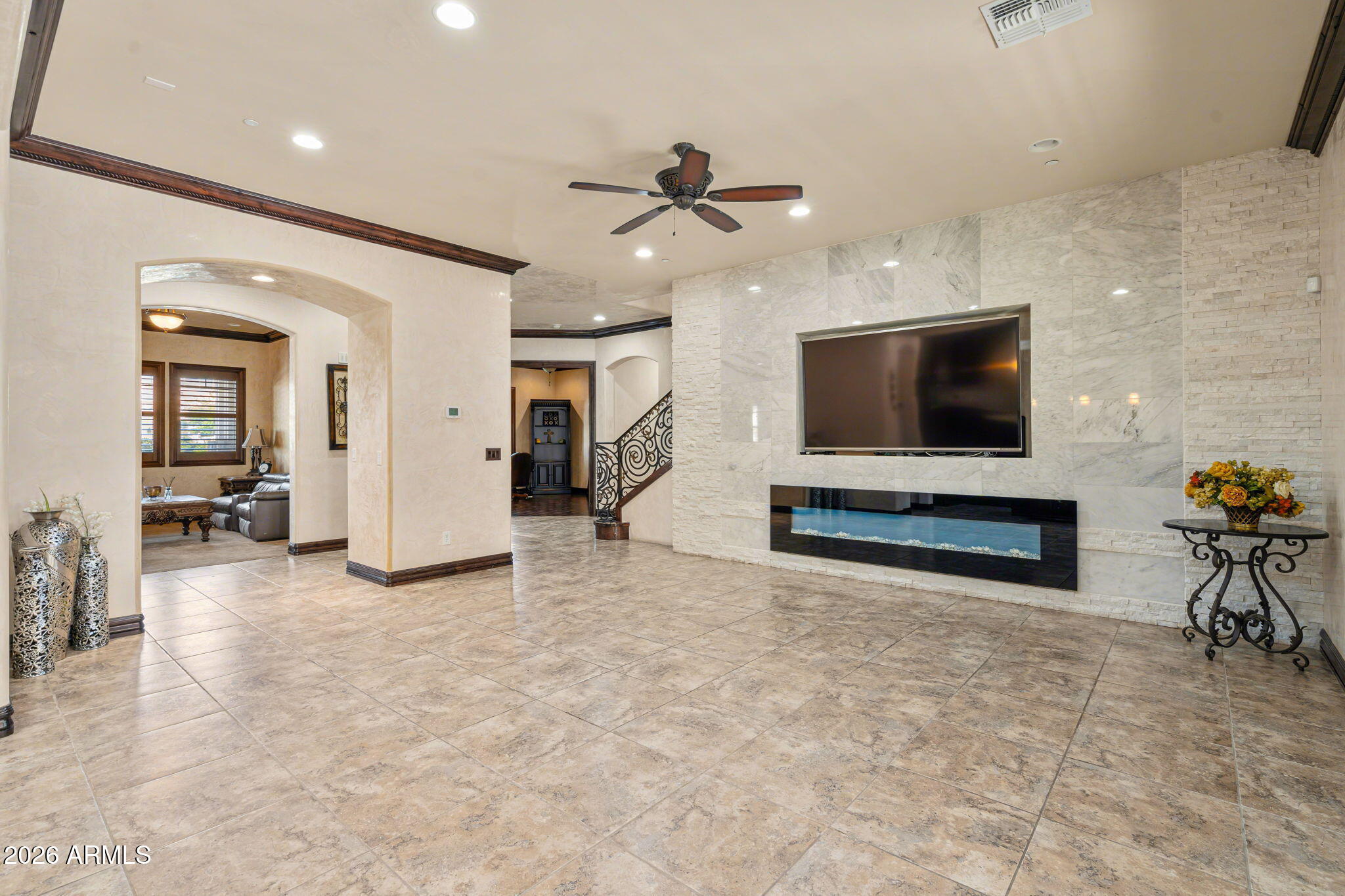 2822 East Constance Way Phoenix, AZ 85042 - Photo 27 of 64 an empty room with furniture and a flat screen tv
