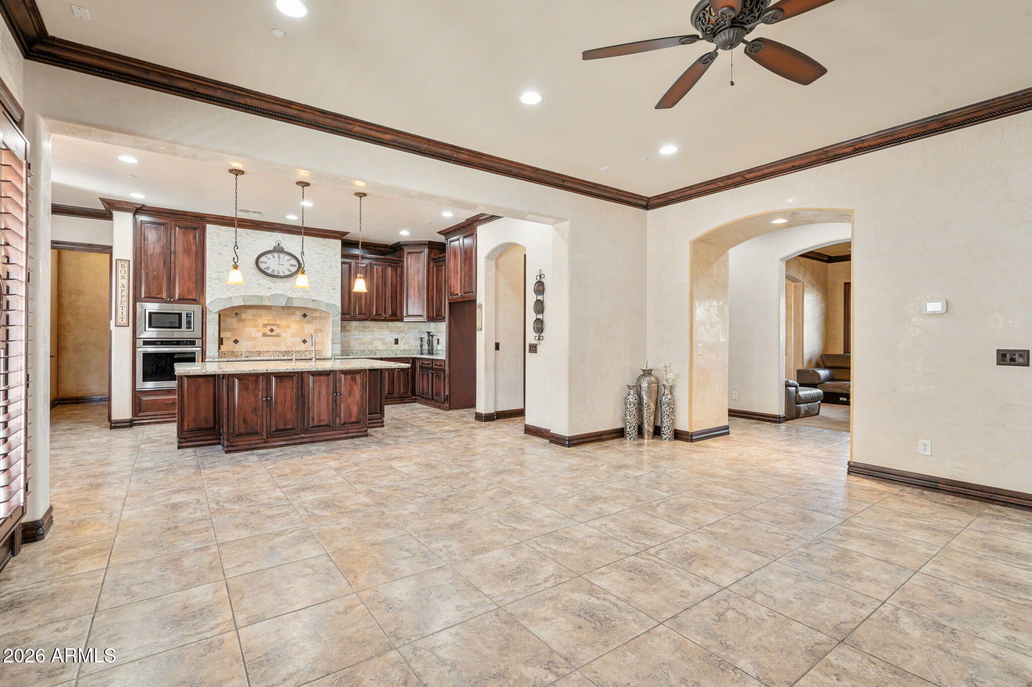 2822 East Constance Way Phoenix, AZ 85042 - Photo 29 of 64 a view of a livingroom with furniture and a ceiling fan