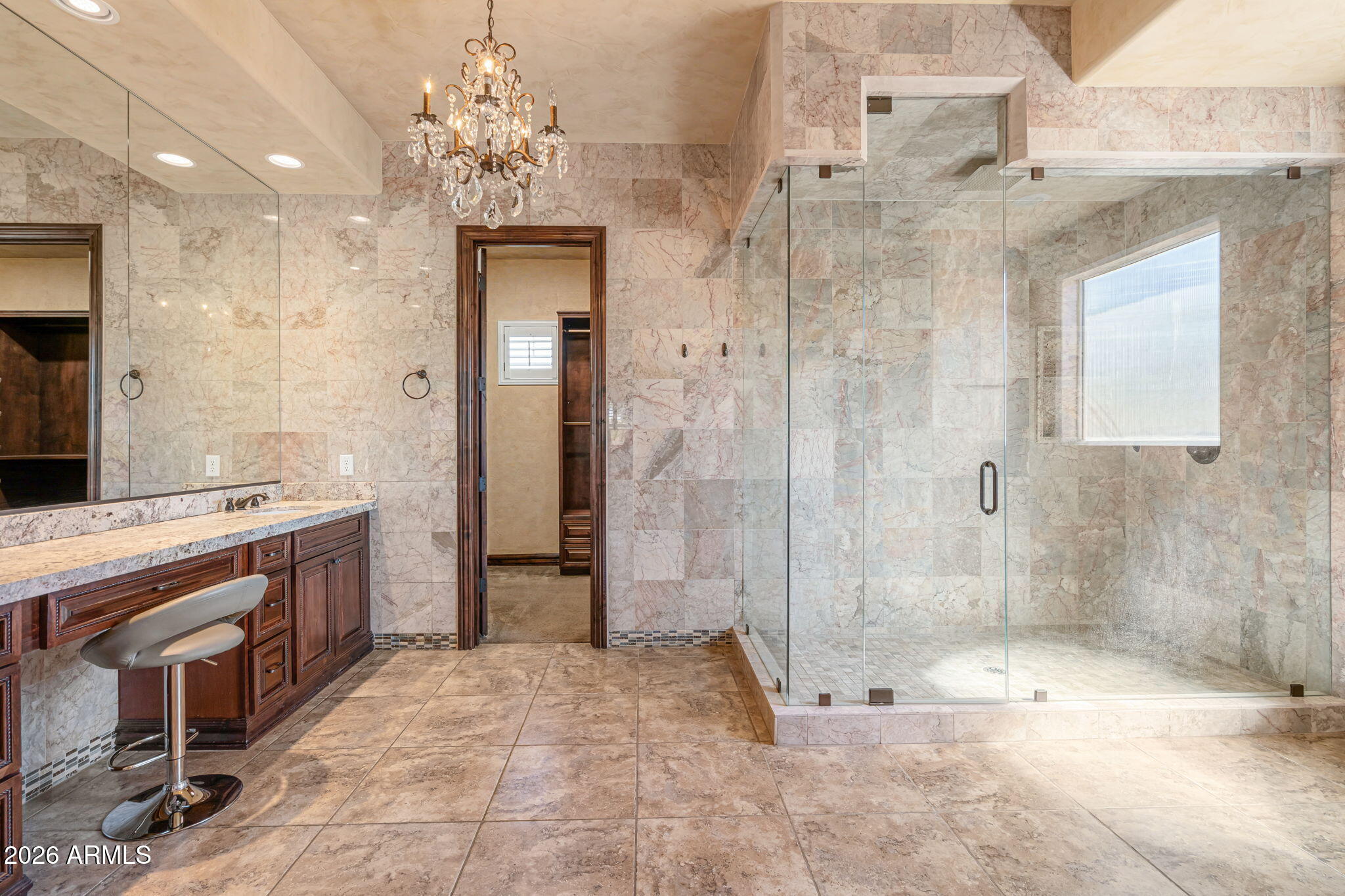 2822 East Constance Way Phoenix, AZ 85042 - Photo 32 of 64 a bathroom with a shower sink and mirror