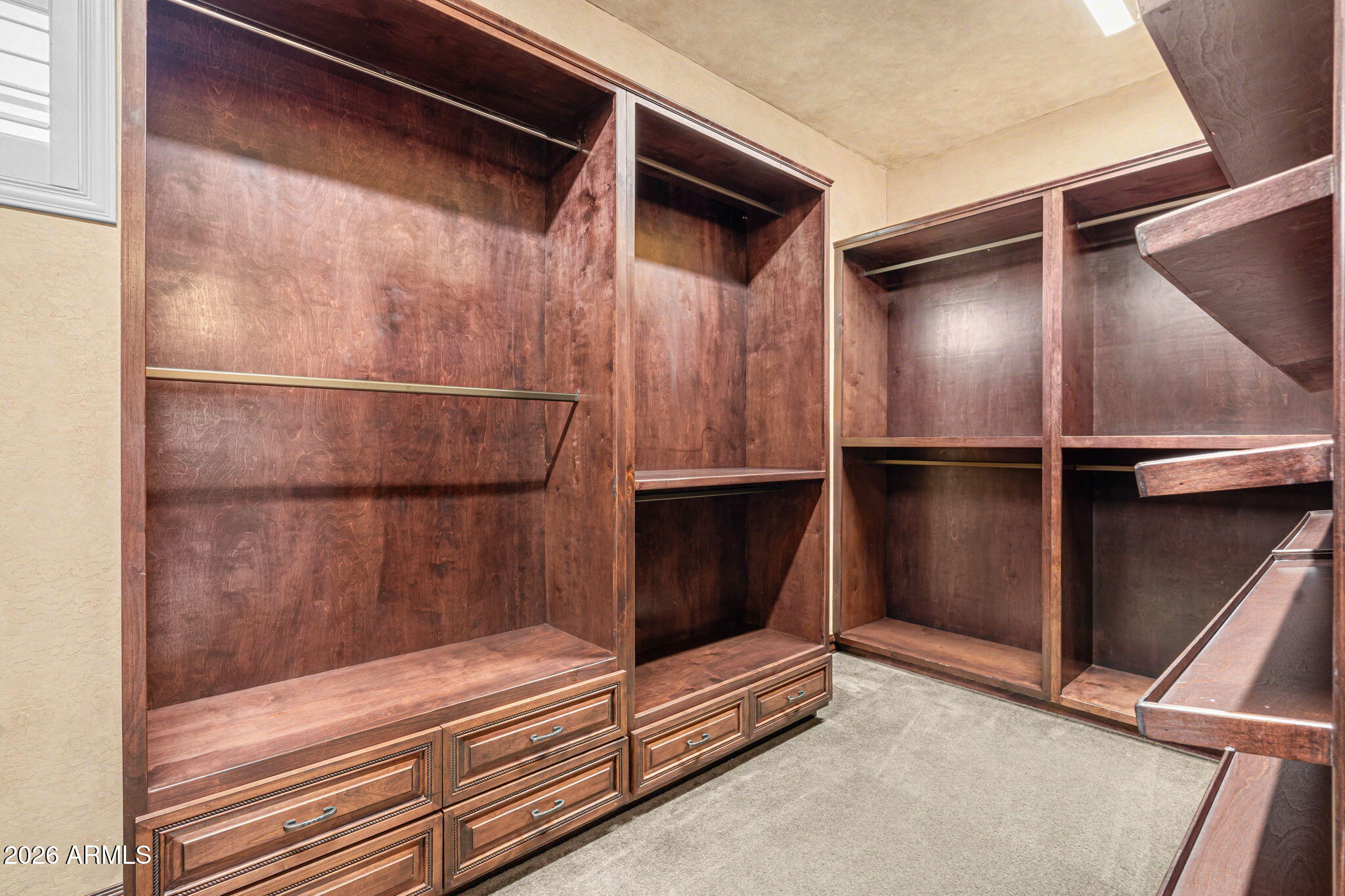 2822 East Constance Way Phoenix, AZ 85042 - Photo 37 of 64 a view of walk in closet with wooden floor