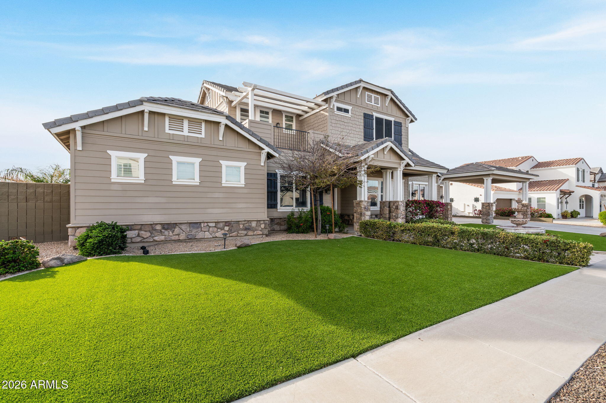 2822 East Constance Way Phoenix, AZ 85042 - Photo 4 of 64 a front view of a house with a garden
