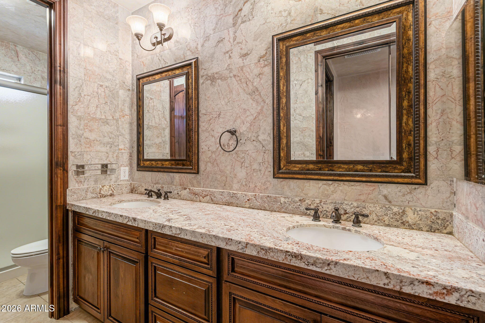 2822 East Constance Way Phoenix, AZ 85042 - Photo 42 of 64 a bathroom with a granite countertop sink vanity and mirror