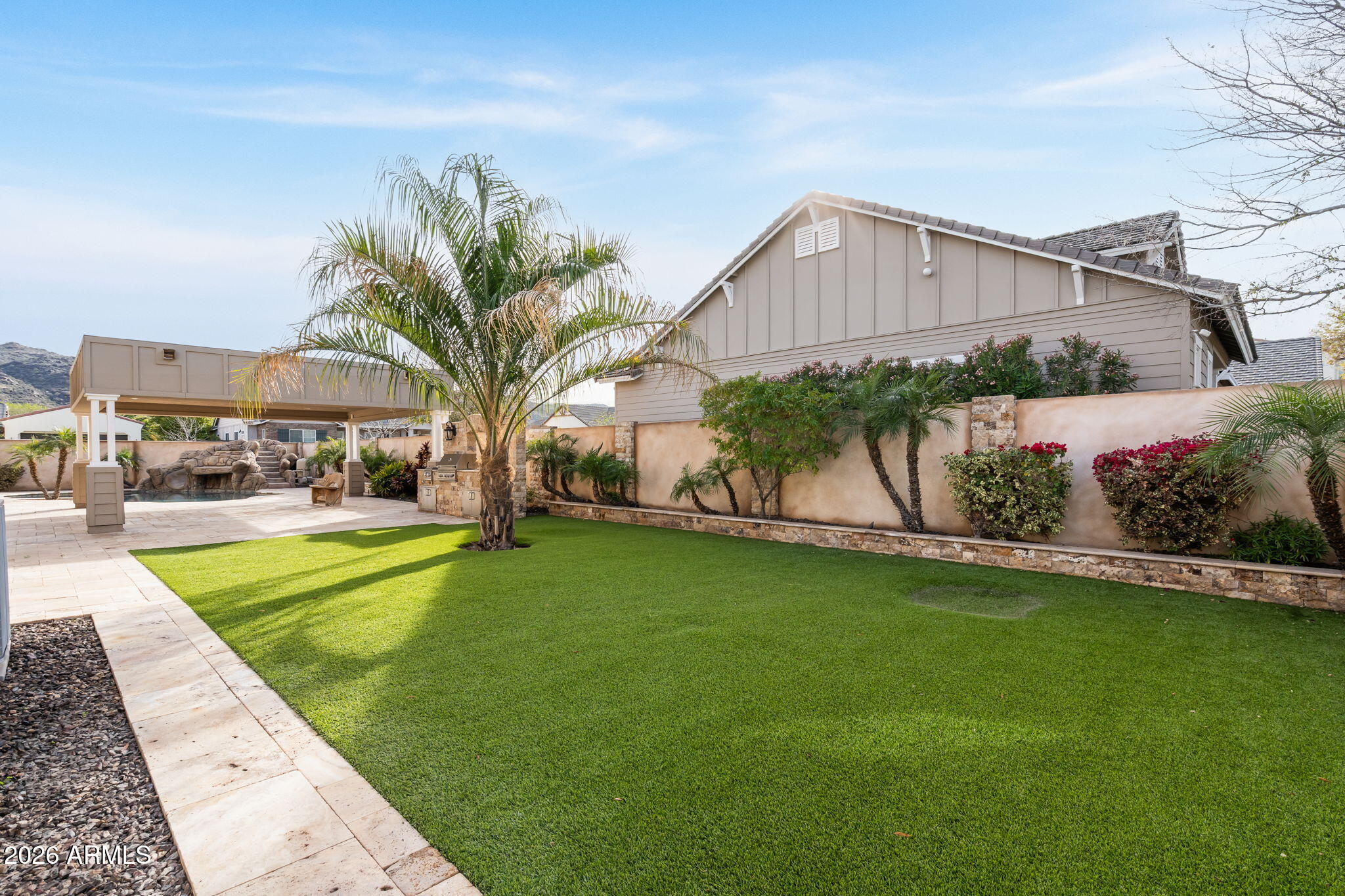 2822 East Constance Way Phoenix, AZ 85042 - Photo 48 of 64 a front view of a house with a garden and a yard