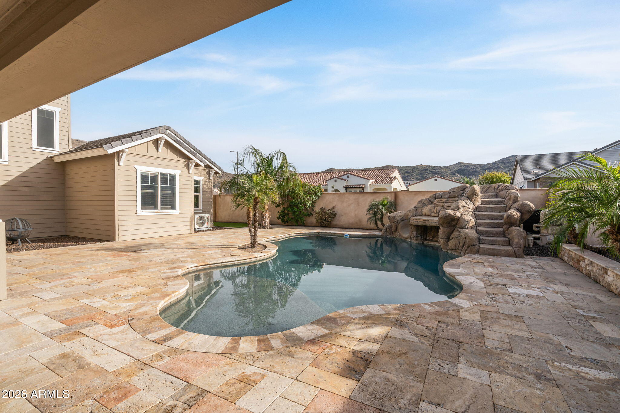 2822 East Constance Way Phoenix, AZ 85042 - Photo 51 of 64 a view of a house with pool fire pit and a yard