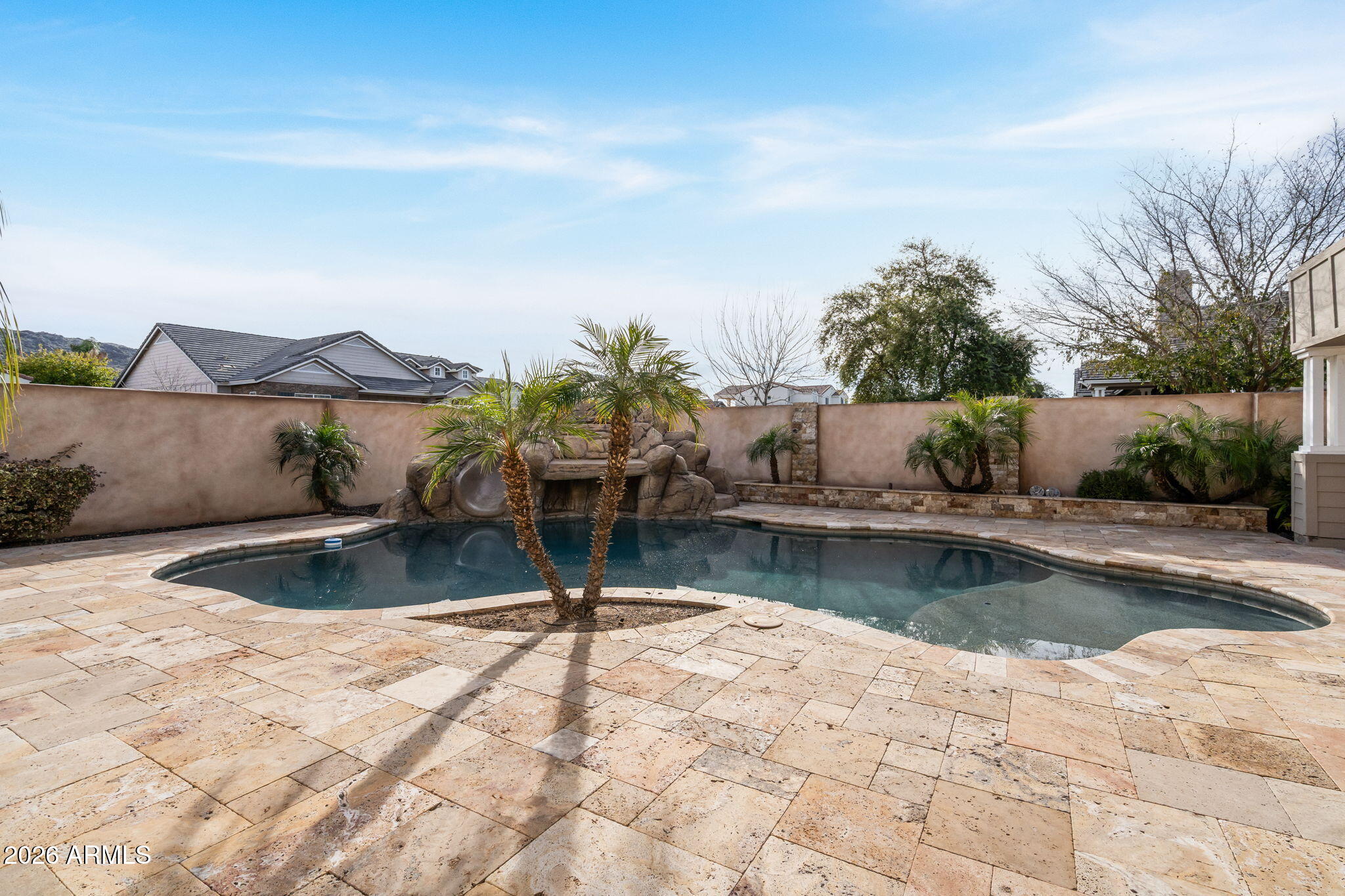2822 East Constance Way Phoenix, AZ 85042 - Photo 52 of 64 a view of a swimming pool with a patio and a yard