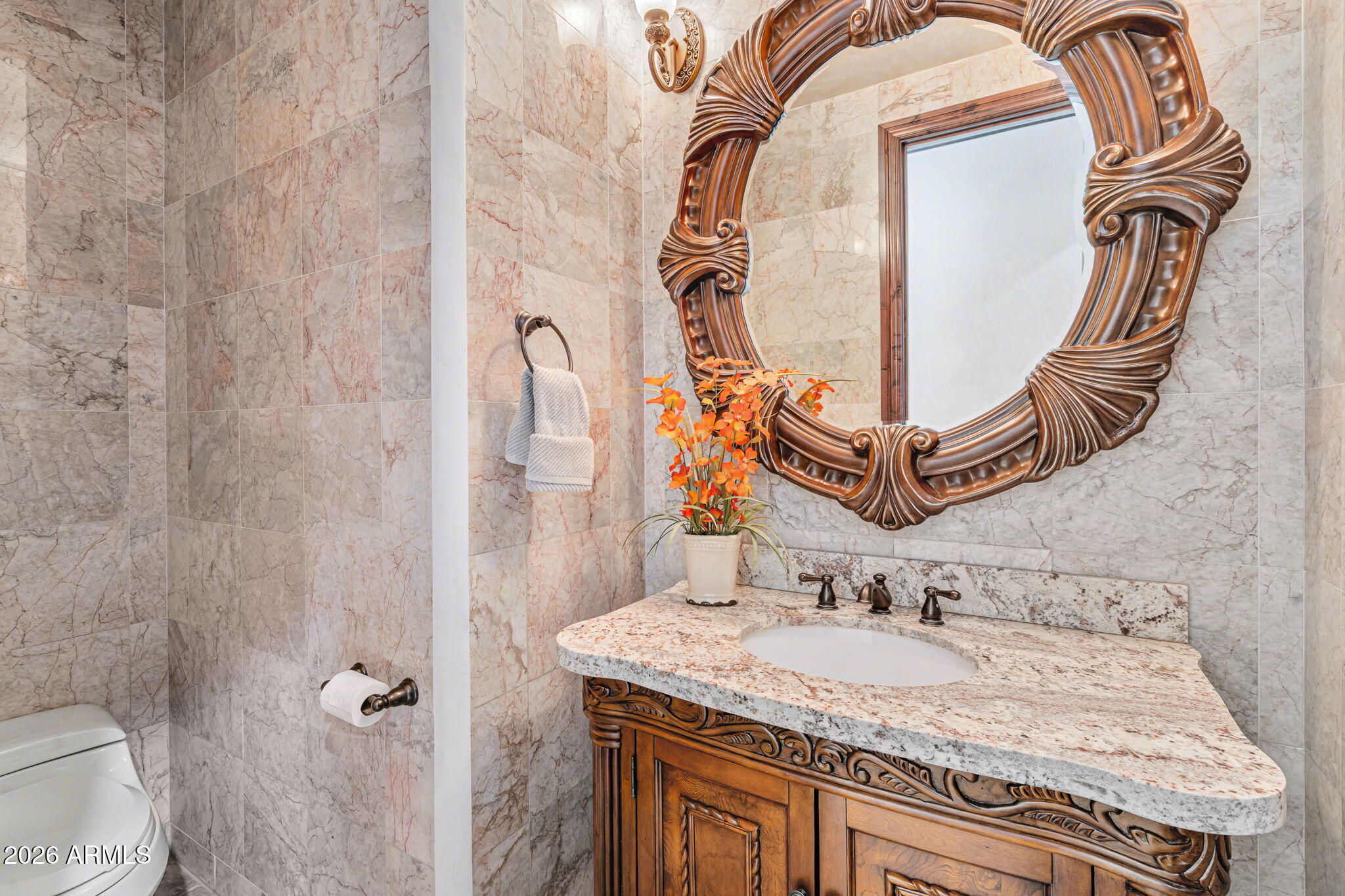 2822 East Constance Way Phoenix, AZ 85042 - Photo 10 of 64 a bathroom with a granite countertop sink and a mirror