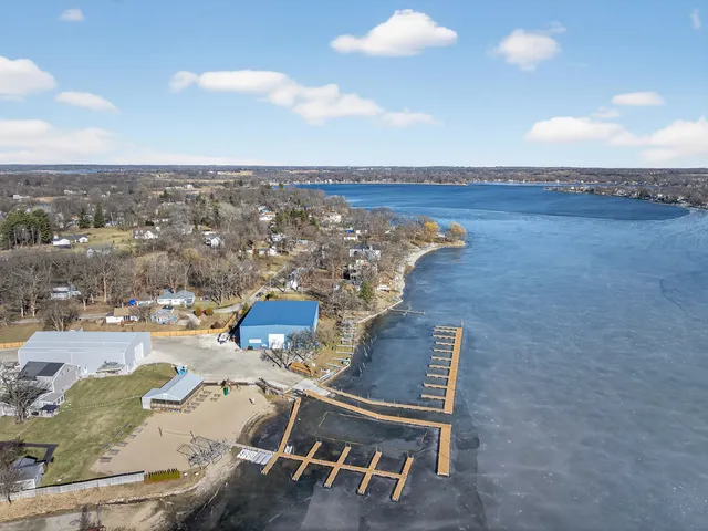 an aerial view of a livingroom with chairs