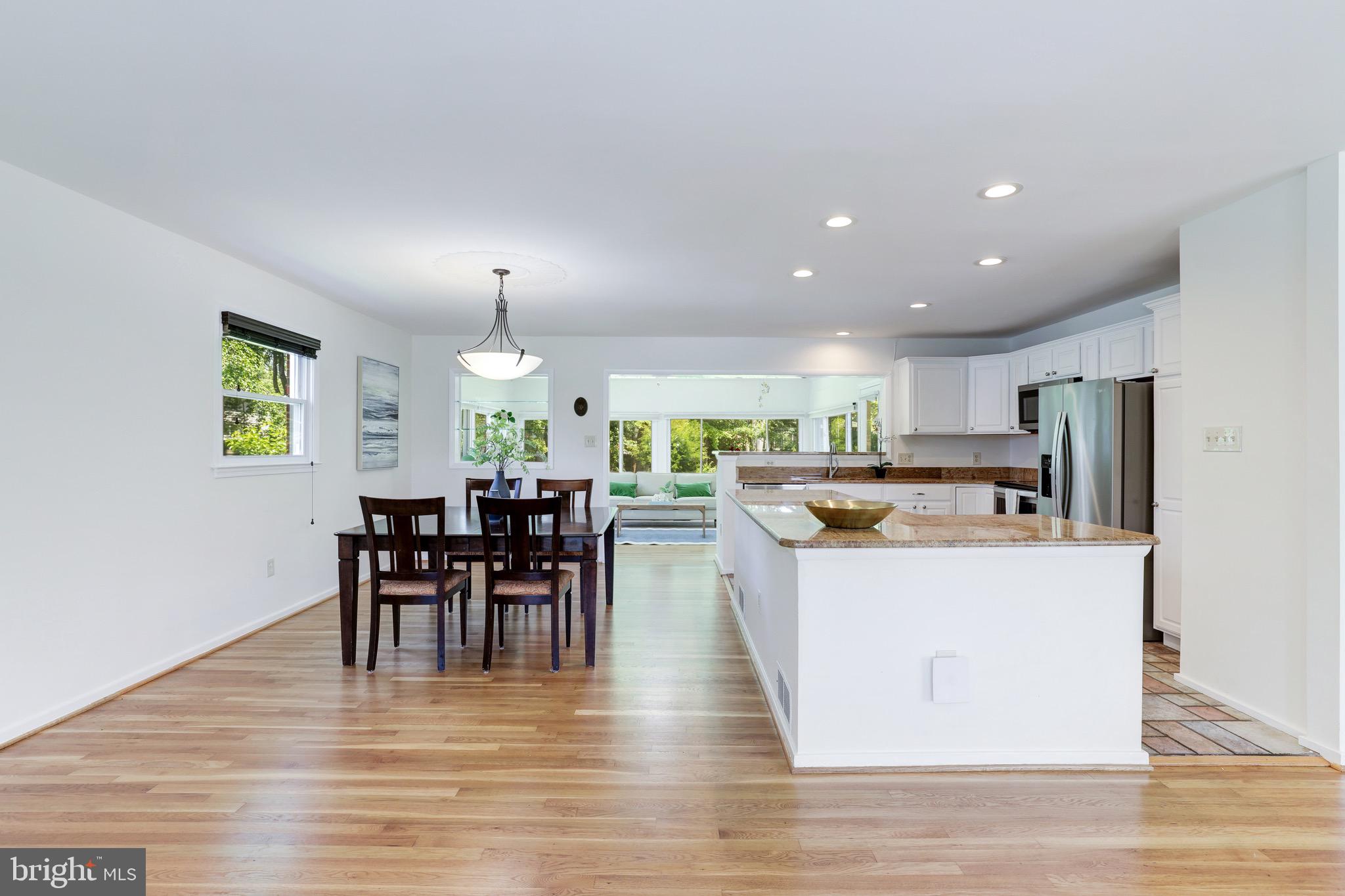 8305 Fort Hunt Road Alexandria, VA 22308 - Photo 13 of 74 a view of a dining room with furniture window and wooden floor