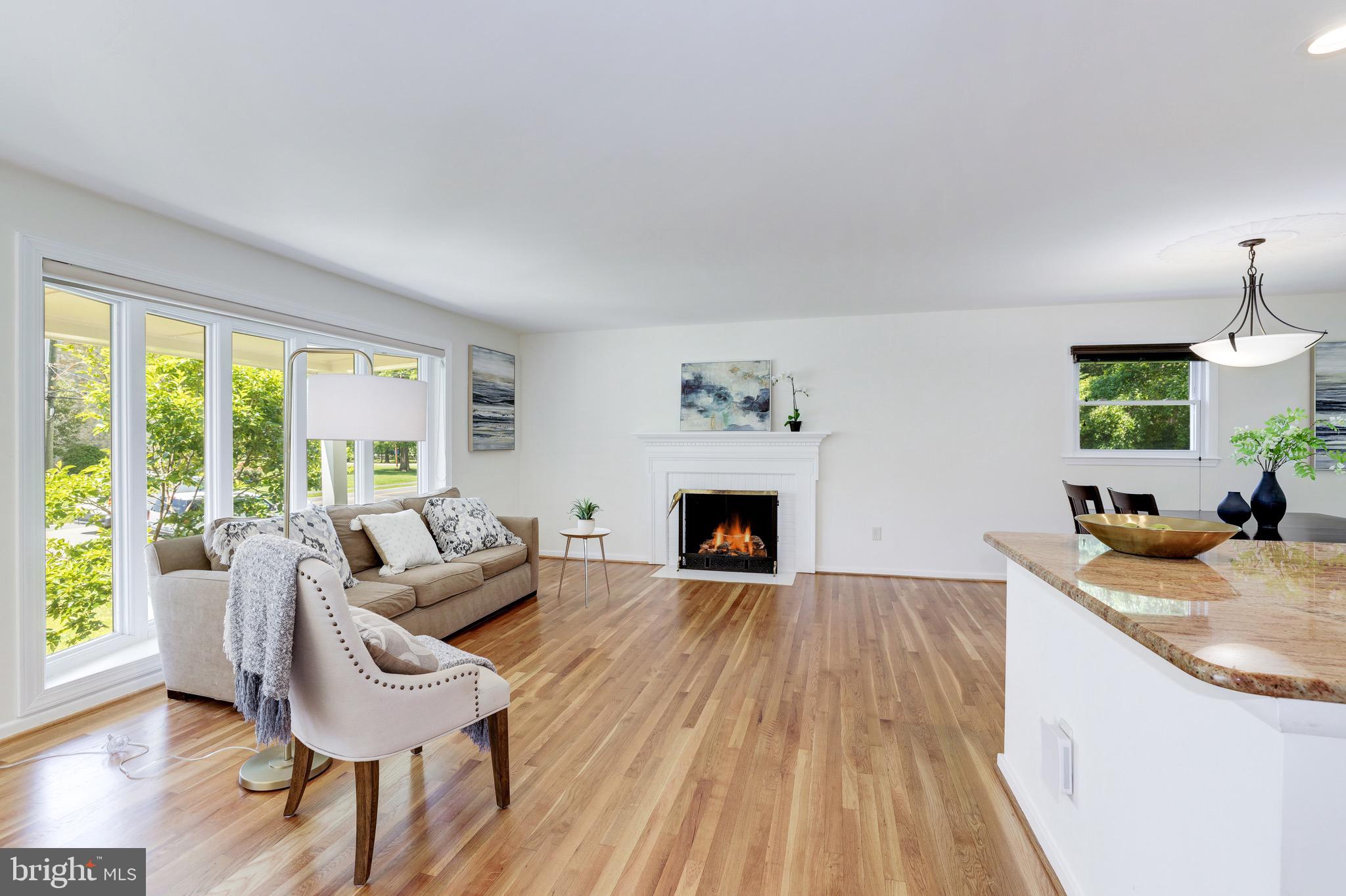 8305 Fort Hunt Road Alexandria, VA 22308 - Photo 15 of 74 a living room with furniture and a fireplace