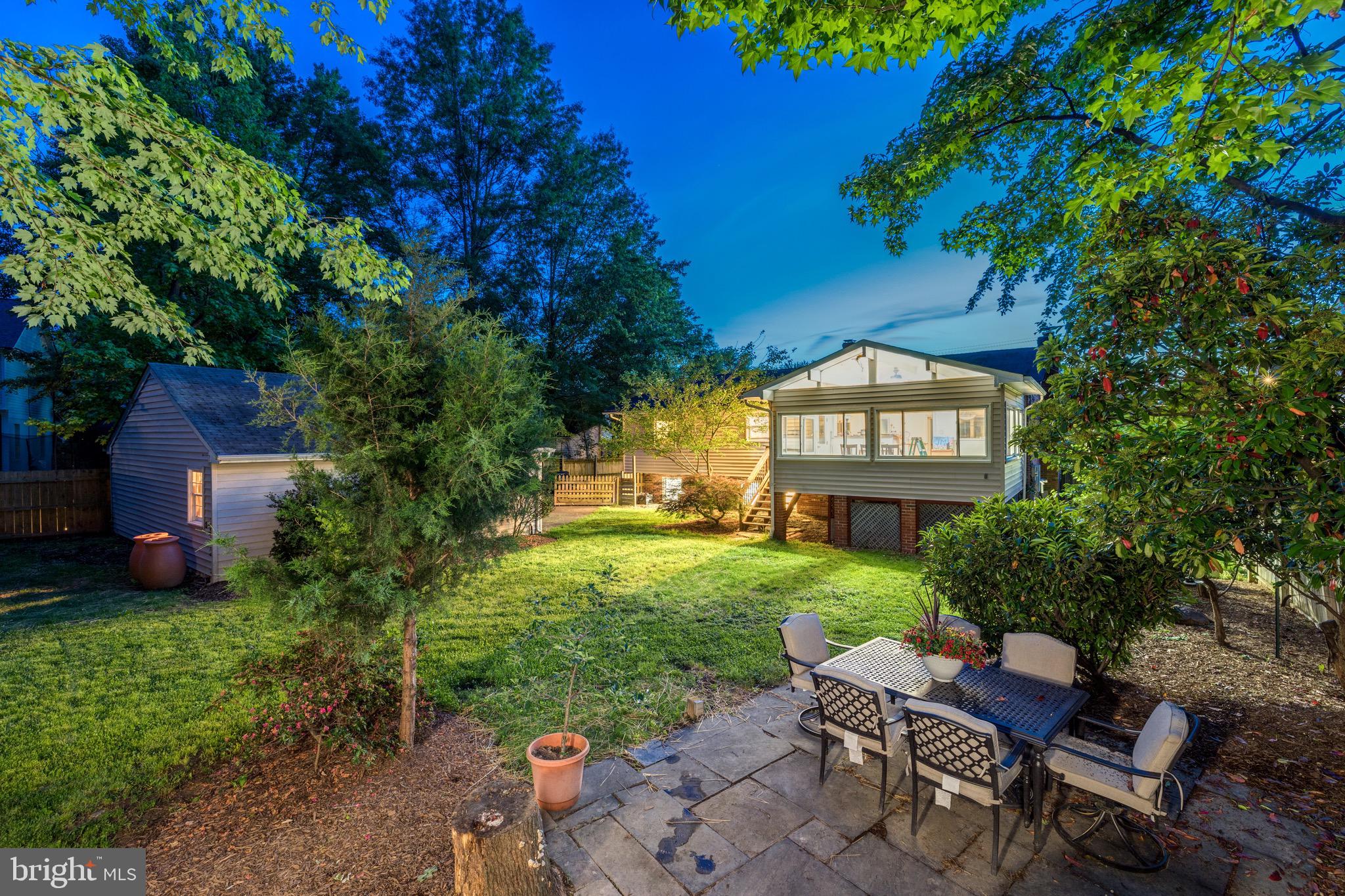 8305 Fort Hunt Road Alexandria, VA 22308 - Photo 3 of 74 a view of a chairs in a backyard