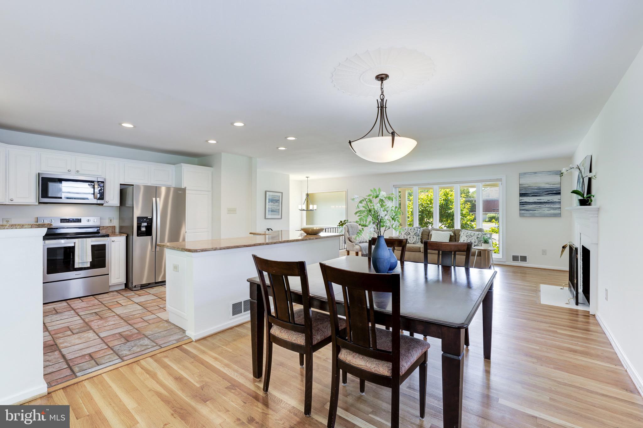 8305 Fort Hunt Road Alexandria, VA 22308 - Photo 24 of 74 a view of a dining room with furniture window and wooden floor