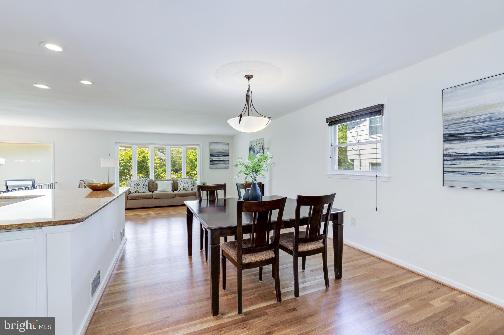 8305 Fort Hunt Road Alexandria, VA 22308 - Photo 25 of 74 a view of a dining room with furniture window and wooden floor