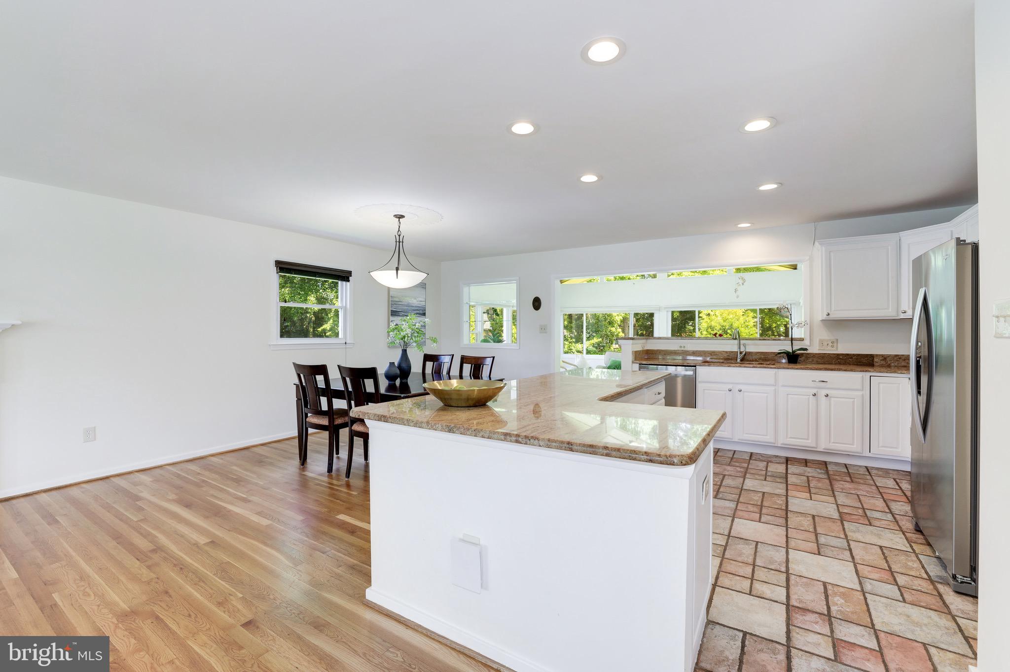 8305 Fort Hunt Road Alexandria, VA 22308 - Photo 28 of 74 a kitchen with stainless steel appliances granite countertop a sink and a refrigerator