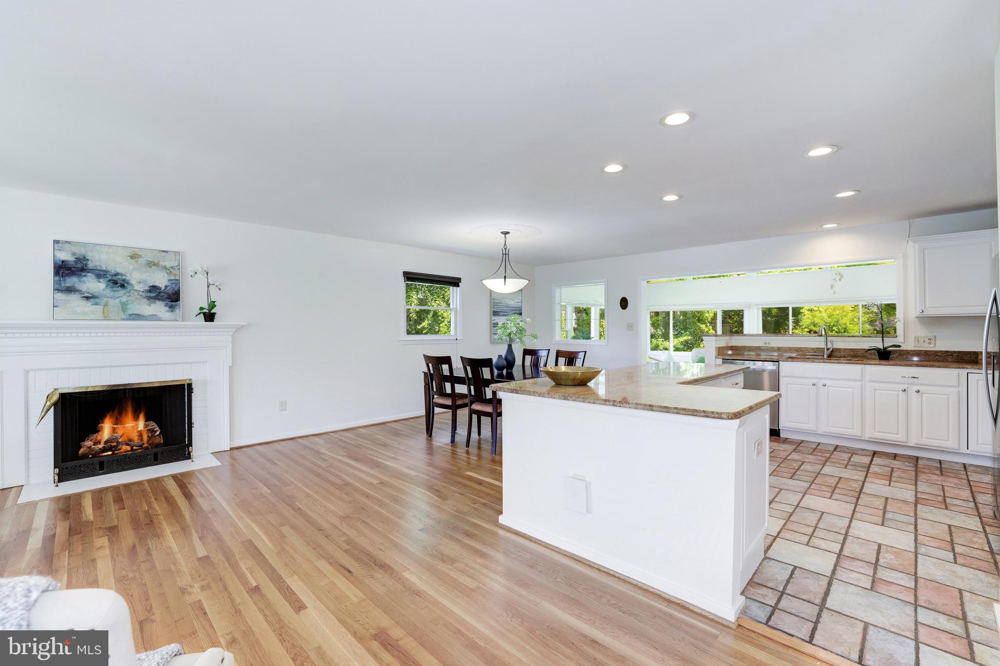8305 Fort Hunt Road Alexandria, VA 22308 - Photo 29 of 74 a living room with furniture and a fireplace