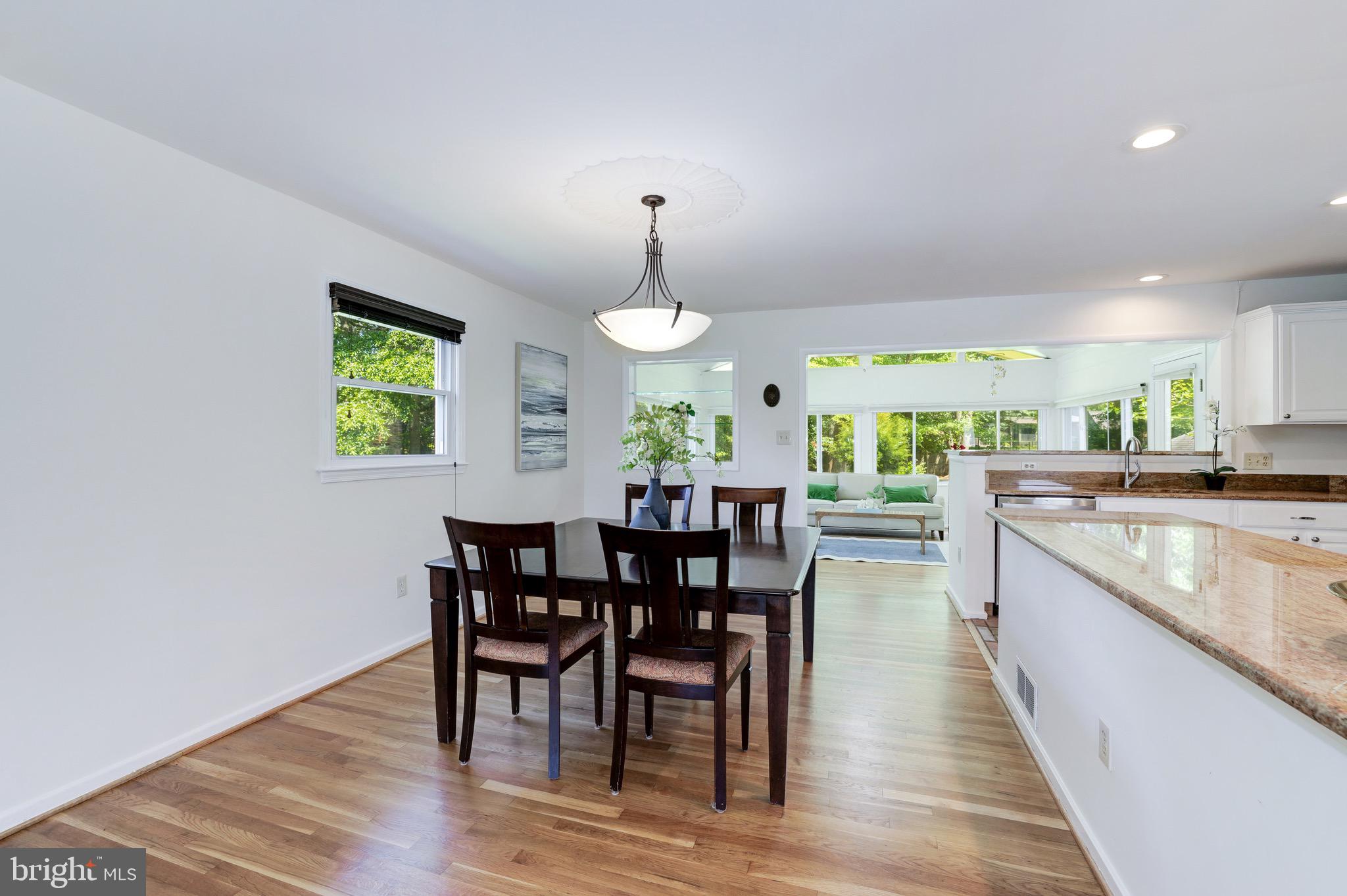 8305 Fort Hunt Road Alexandria, VA 22308 - Photo 30 of 74 a view of a dining room with furniture and wooden floor