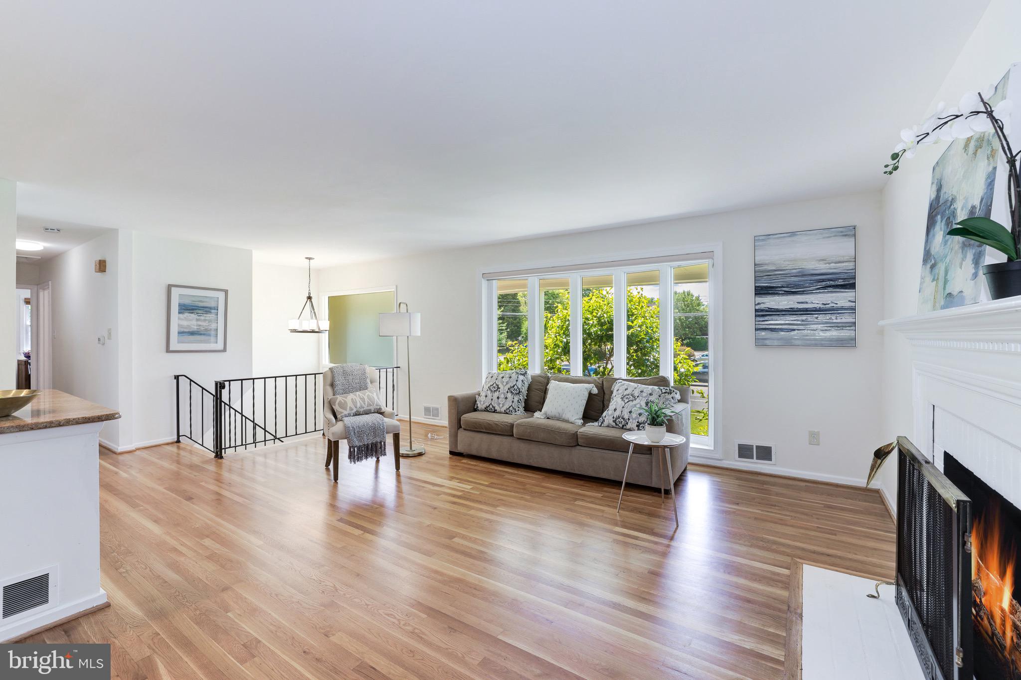 8305 Fort Hunt Road Alexandria, VA 22308 - Photo 31 of 74 a living room with furniture and a wooden floor
