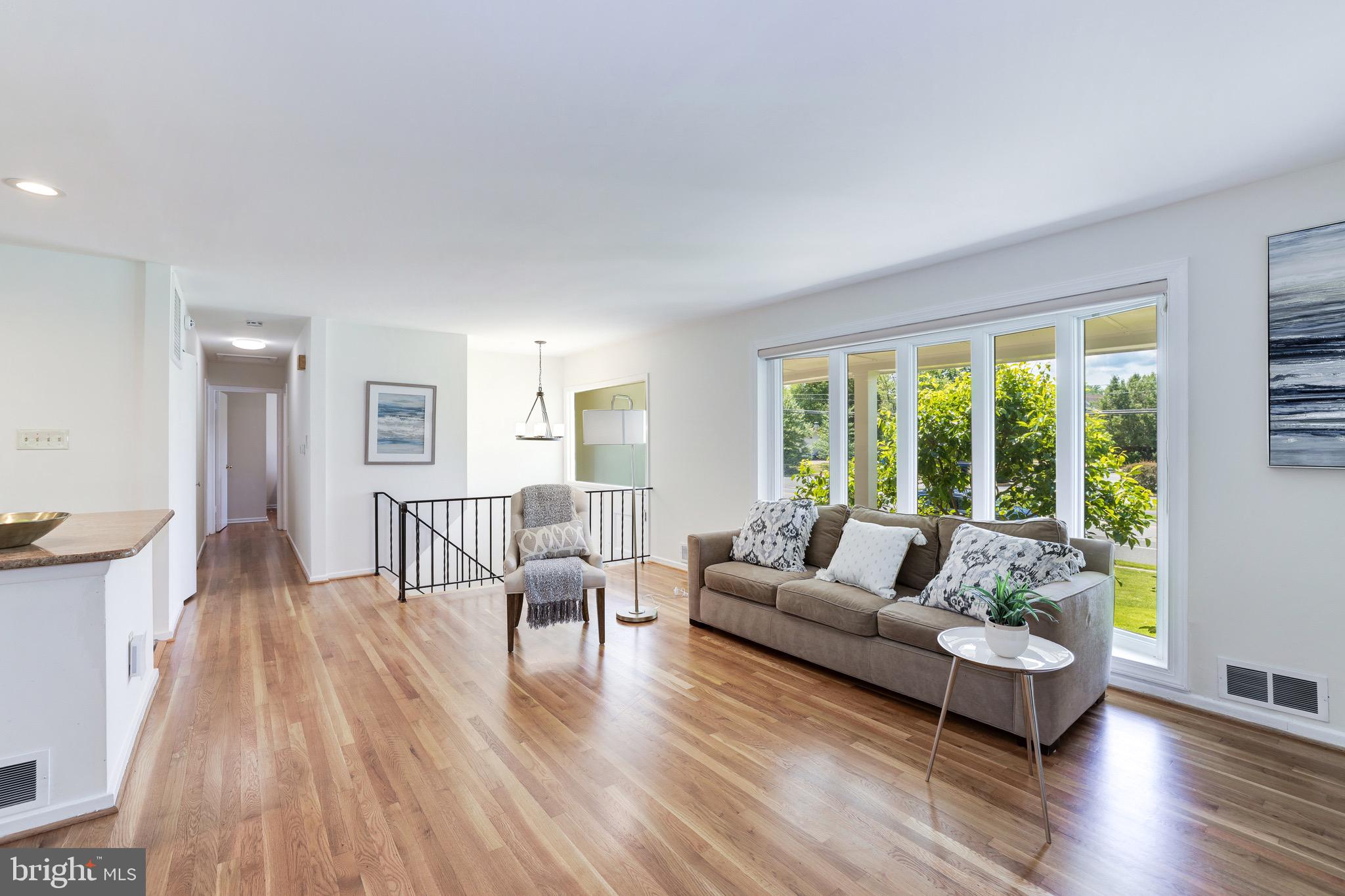 8305 Fort Hunt Road Alexandria, VA 22308 - Photo 32 of 74 a living room with furniture and a large window