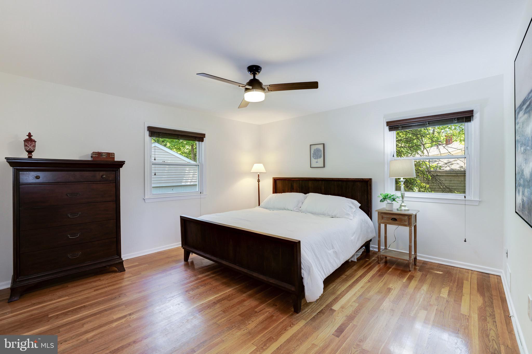 8305 Fort Hunt Road Alexandria, VA 22308 - Photo 34 of 74 a bedroom with a bed and a dresser