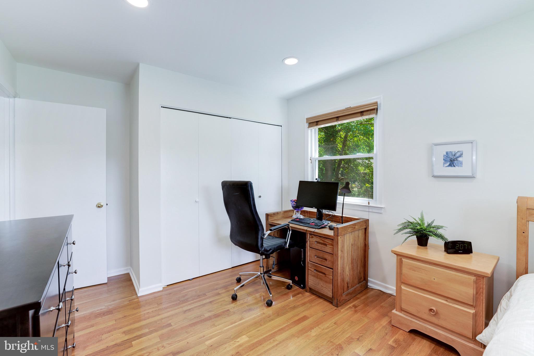 8305 Fort Hunt Road Alexandria, VA 22308 - Photo 39 of 74 a view of a workspace with furniture and a window