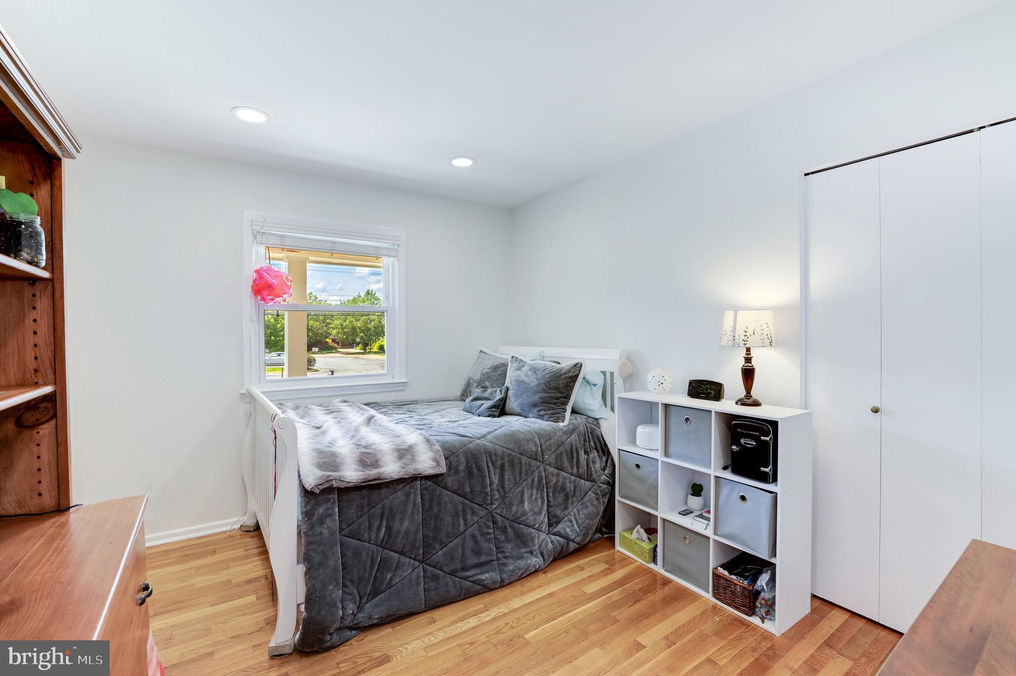 8305 Fort Hunt Road Alexandria, VA 22308 - Photo 40 of 74 a bedroom with a bed and a bookshelf