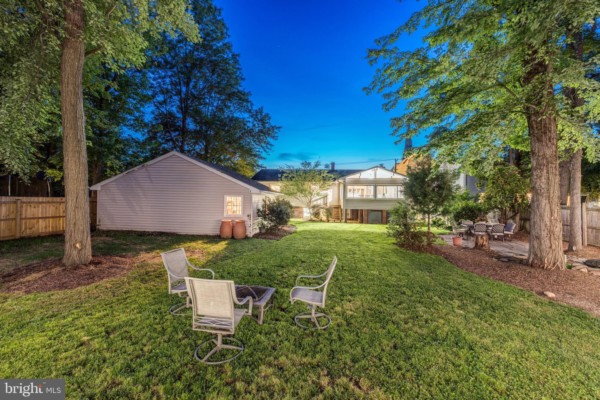 8305 Fort Hunt Road Alexandria, VA 22308 - Photo 5 of 74 a view of a house with backyard and a tree