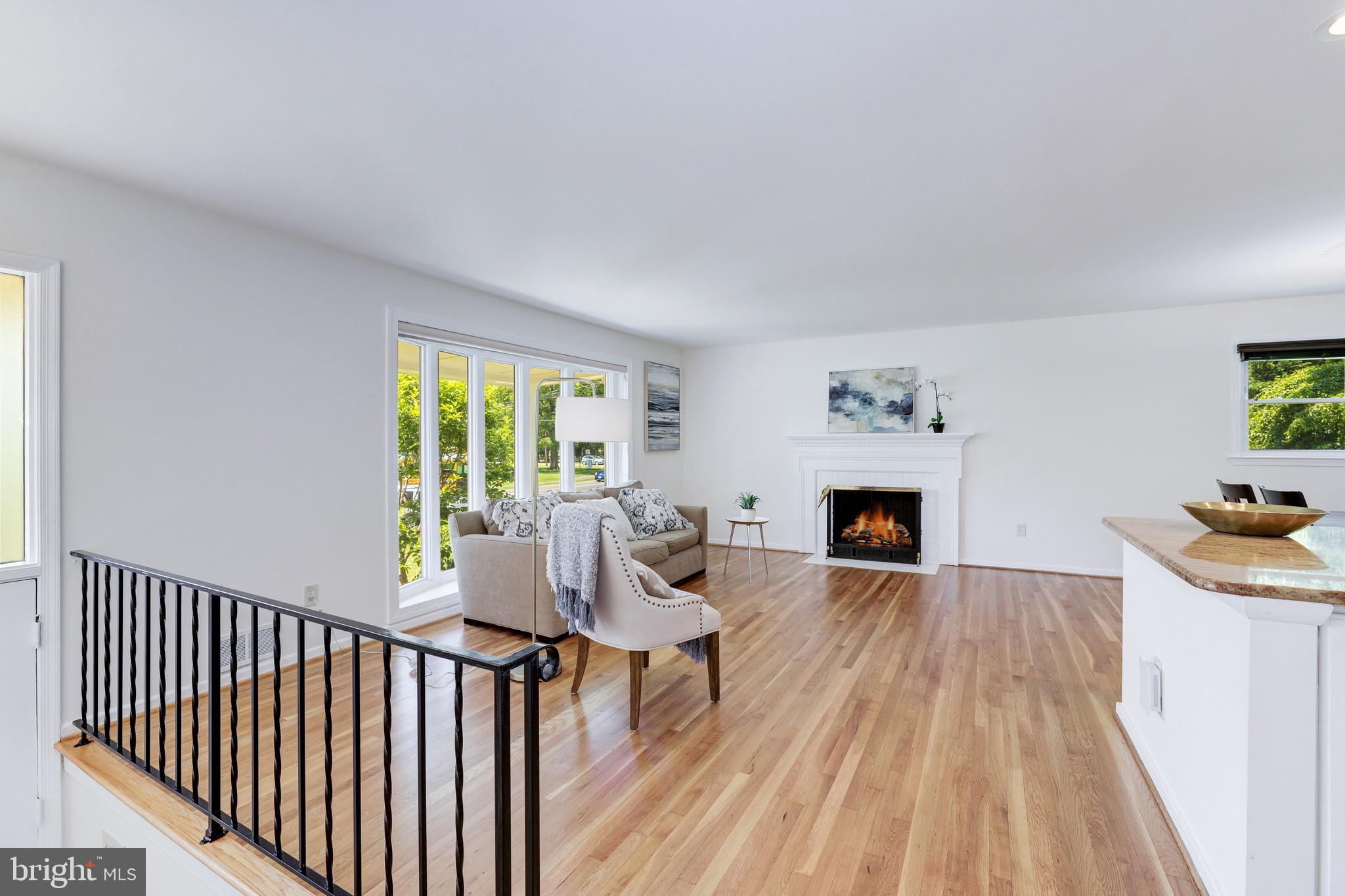 8305 Fort Hunt Road Alexandria, VA 22308 - Photo 42 of 74 a living room with furniture and a fireplace