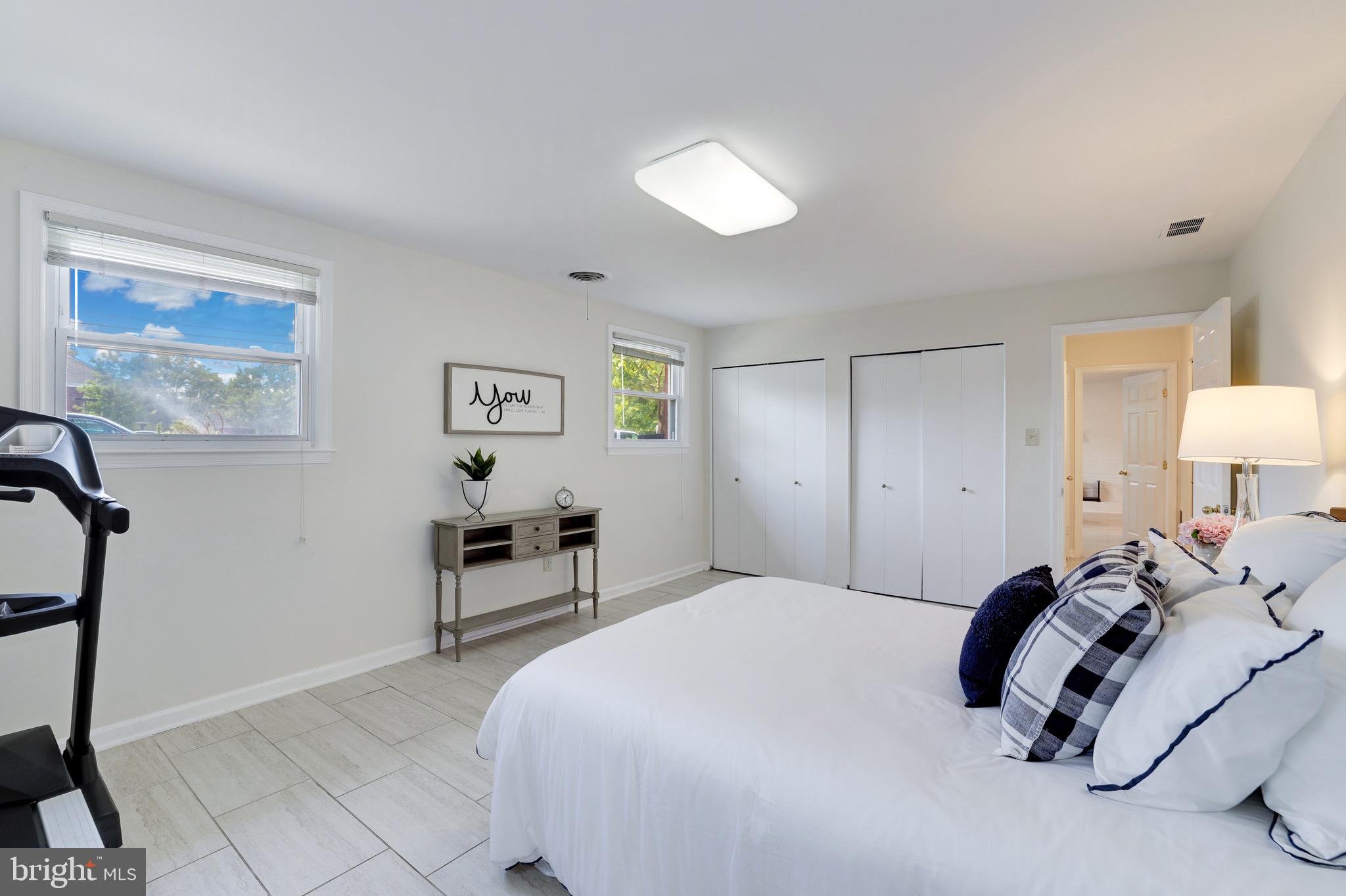 8305 Fort Hunt Road Alexandria, VA 22308 - Photo 46 of 74 a bedroom with a bed and a lamp