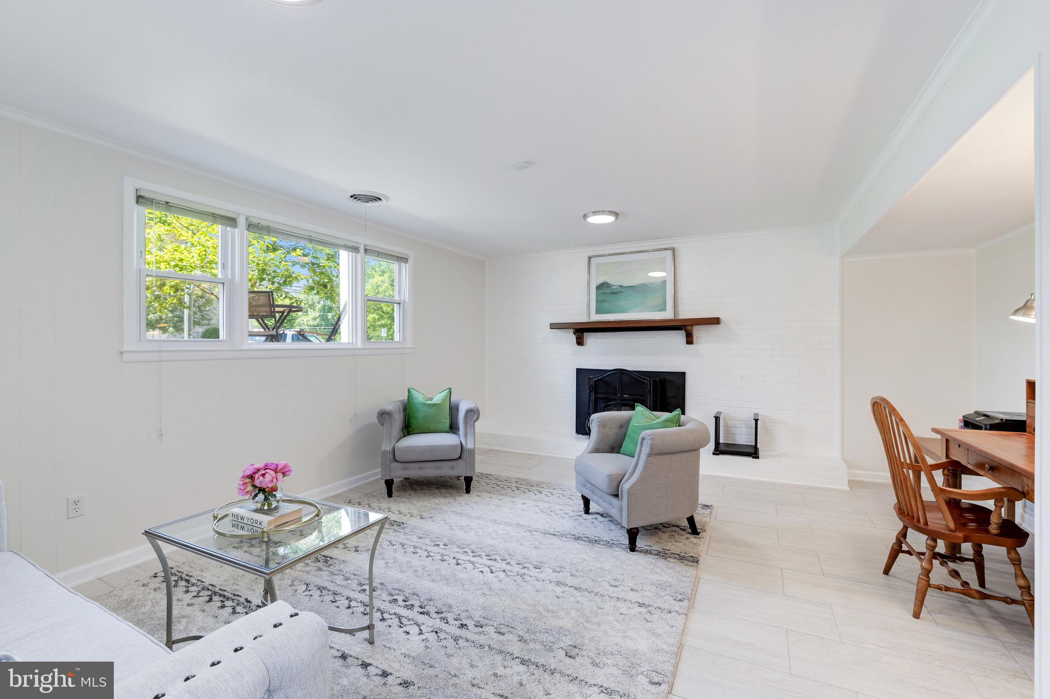 8305 Fort Hunt Road Alexandria, VA 22308 - Photo 51 of 74 a living room with furniture and a fireplace