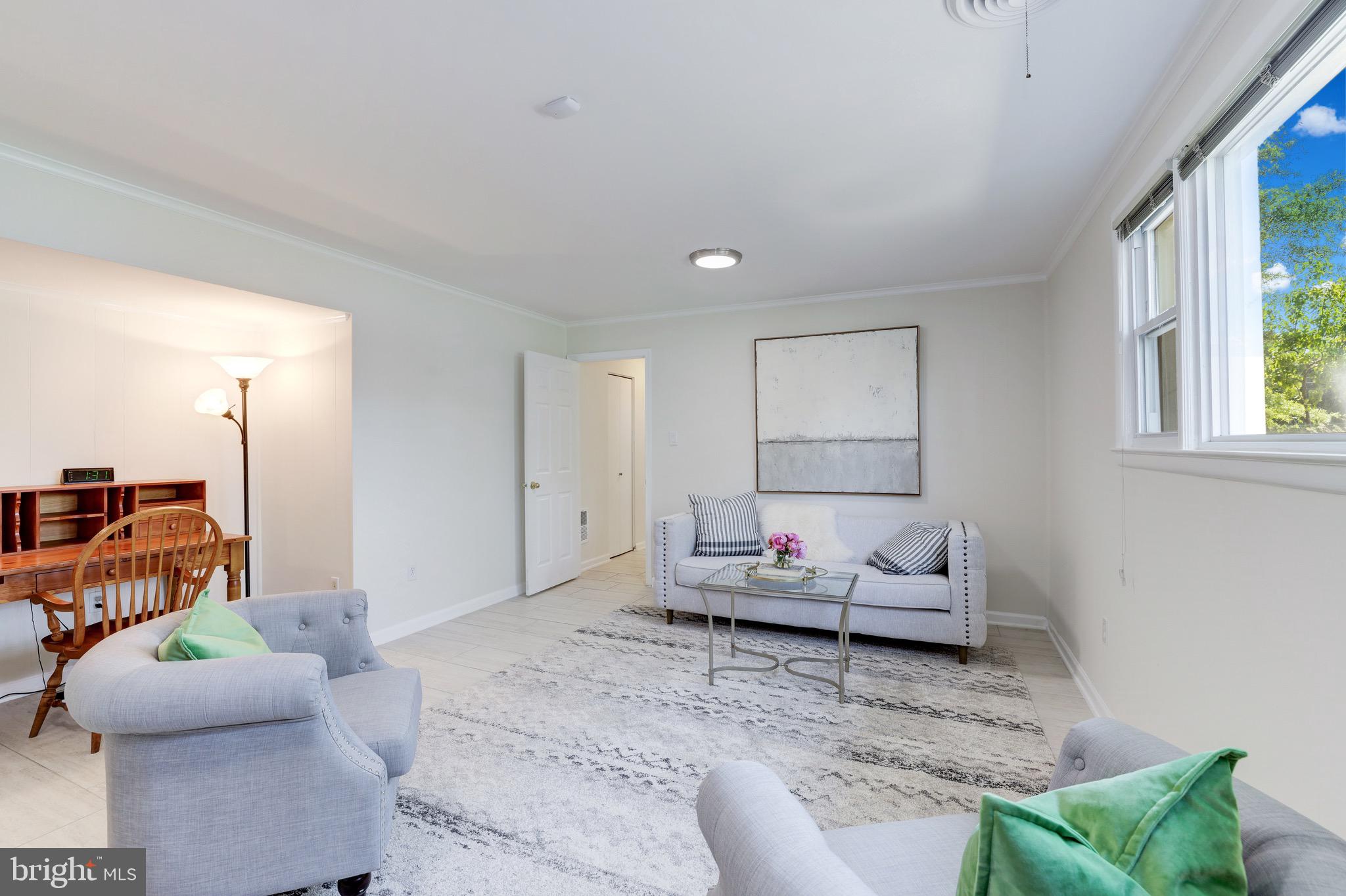 8305 Fort Hunt Road Alexandria, VA 22308 - Photo 53 of 74 a living room with furniture and a window