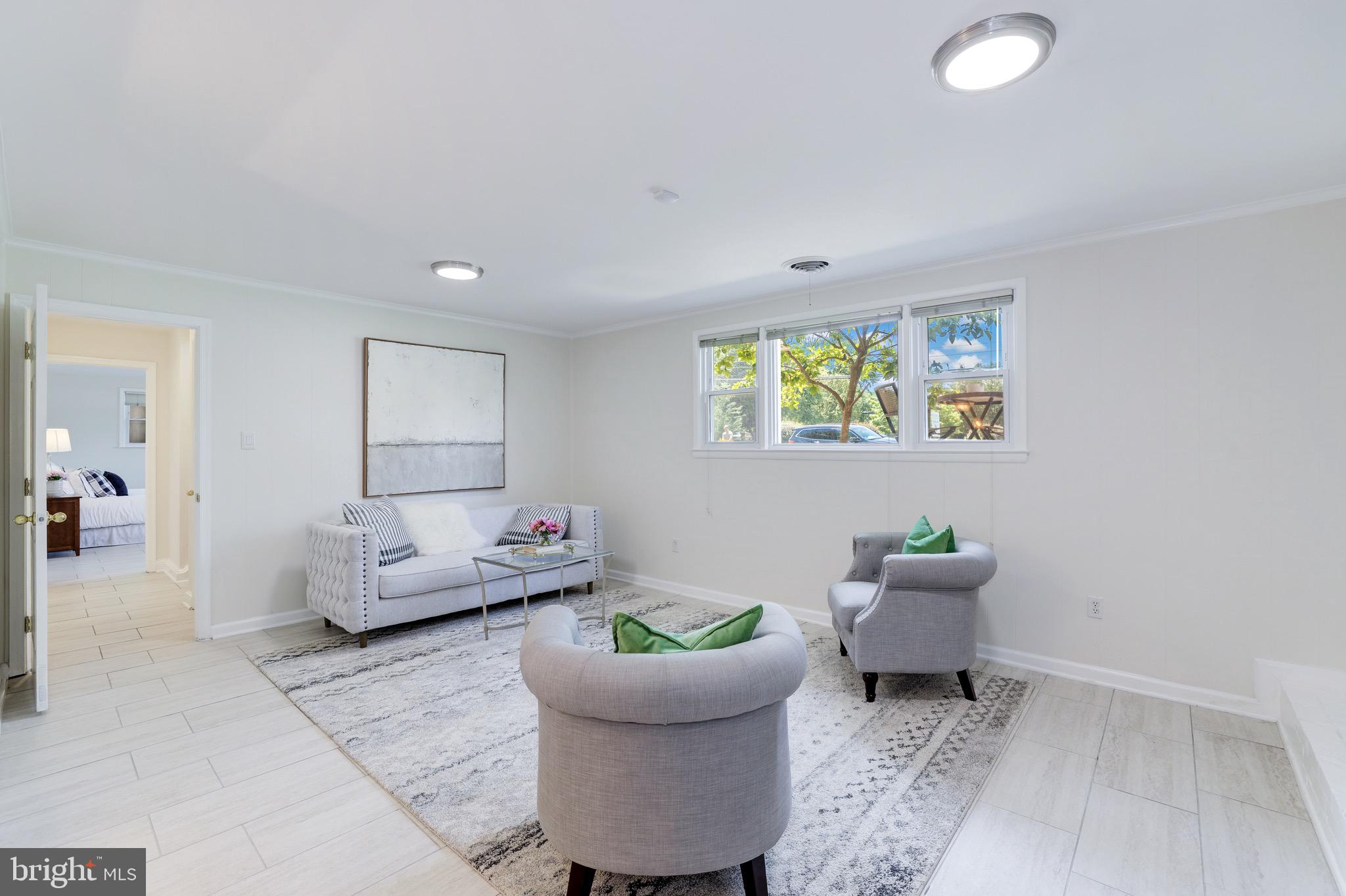 8305 Fort Hunt Road Alexandria, VA 22308 - Photo 54 of 74 a living room with furniture and a window
