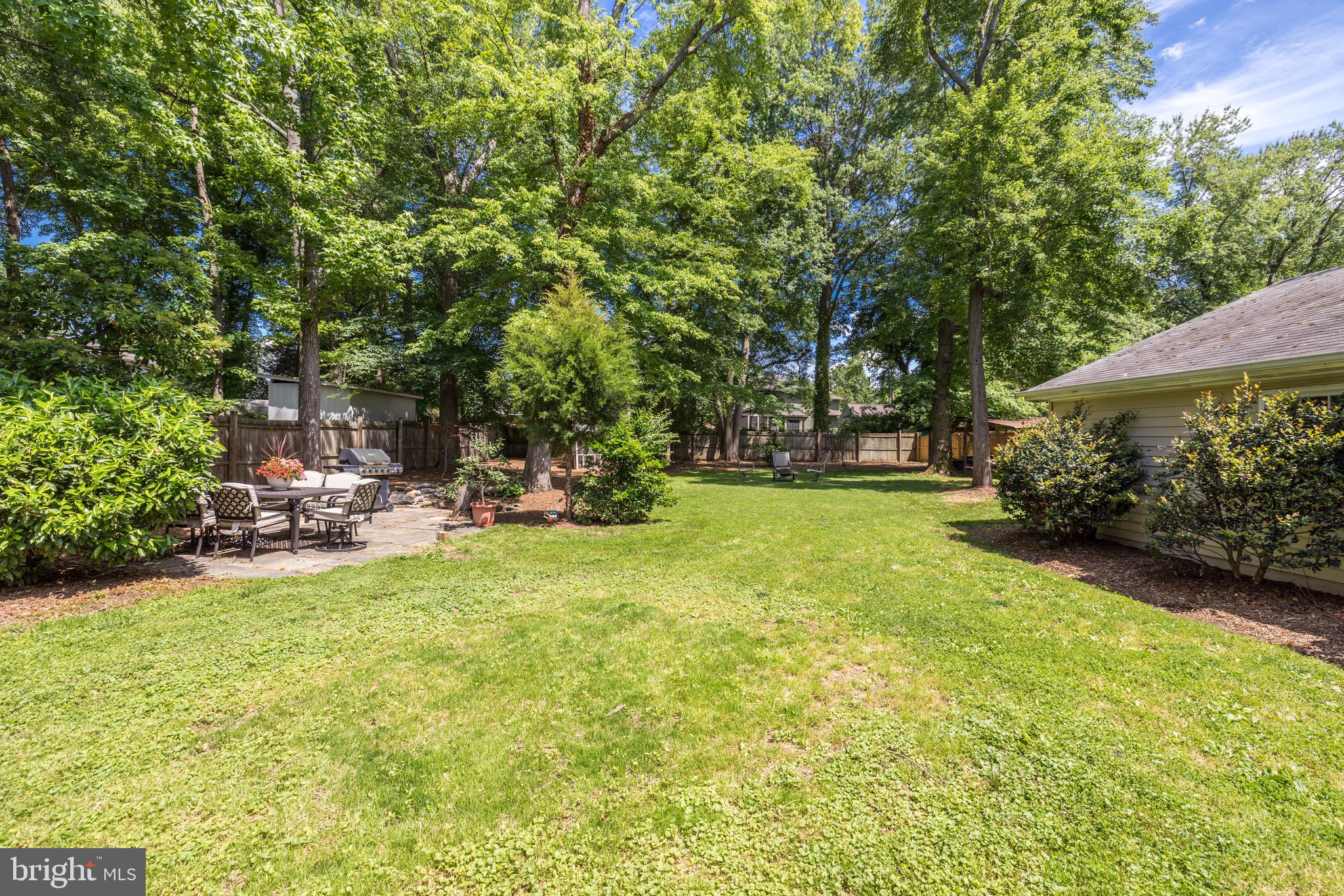 8305 Fort Hunt Road Alexandria, VA 22308 - Photo 58 of 74 a view of swimming pool with lawn chairs and plants
