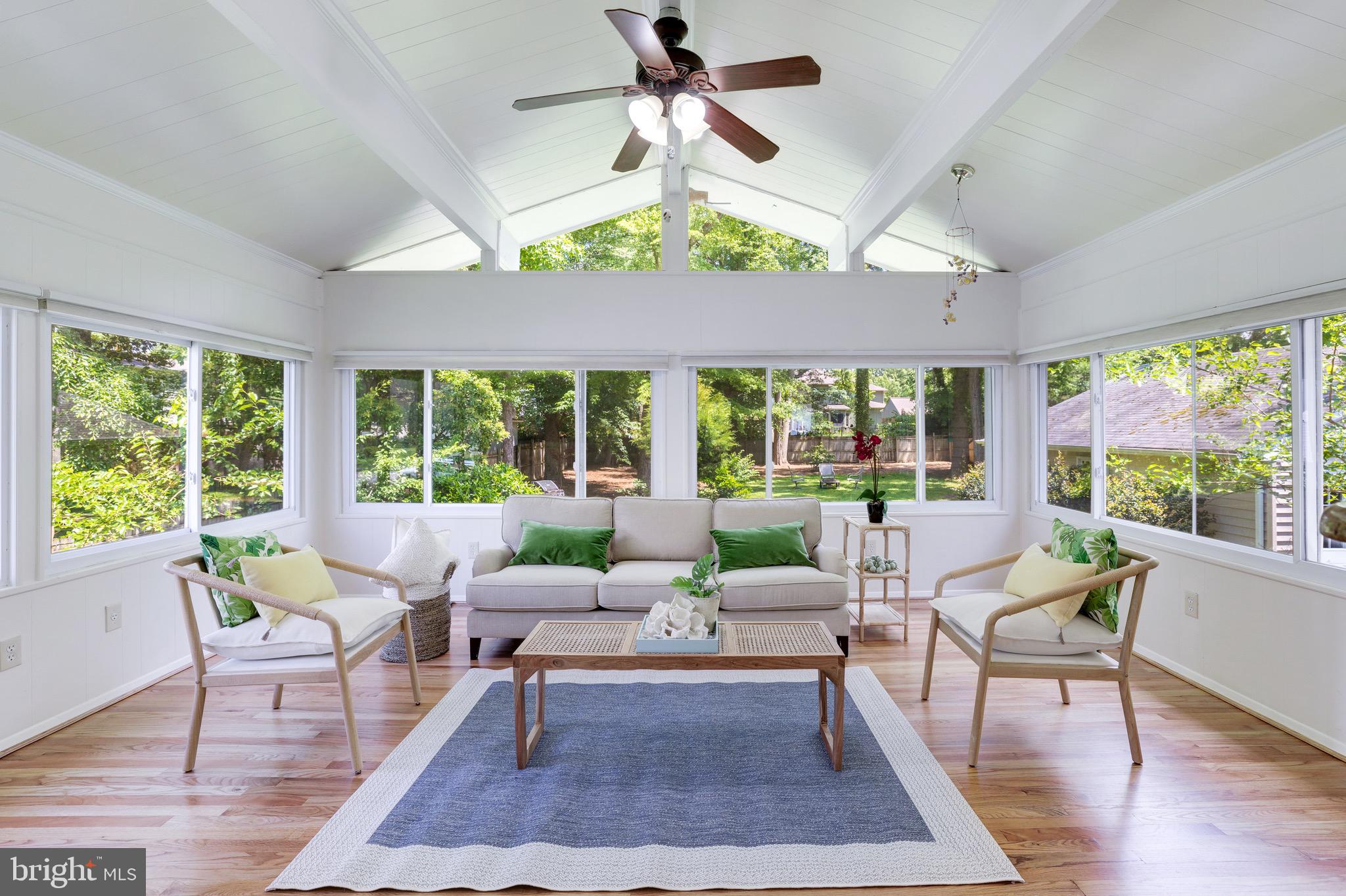 8305 Fort Hunt Road Alexandria, VA 22308 - Photo 7 of 74 a living room with furniture ceiling fan and a large window