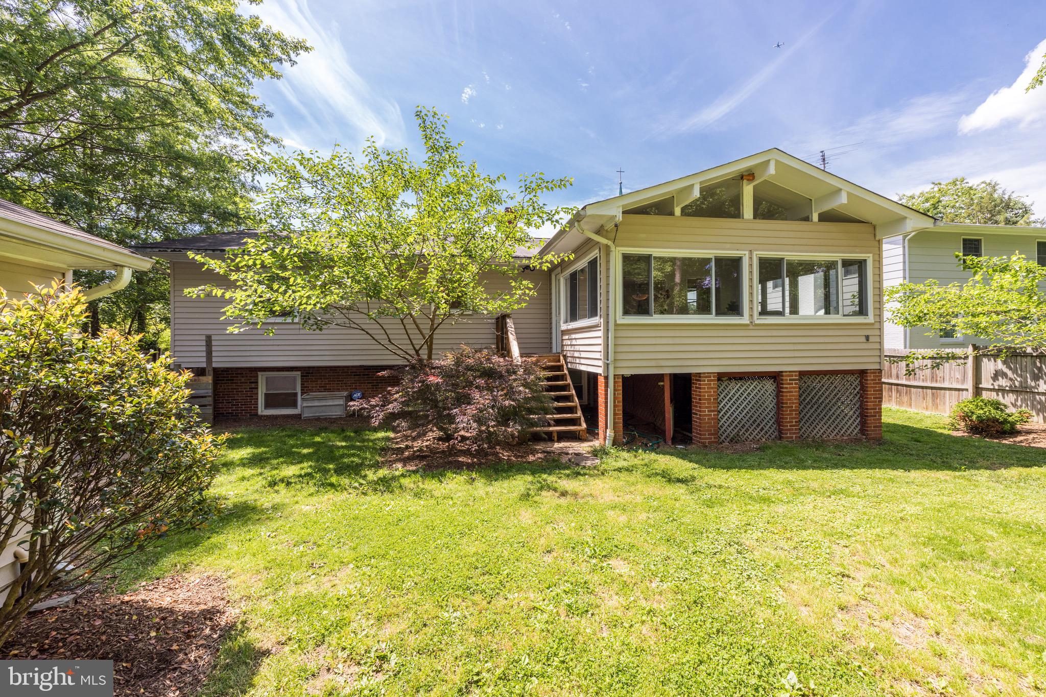 8305 Fort Hunt Road Alexandria, VA 22308 - Photo 68 of 74 a view of a house with a yard balcony and sitting area