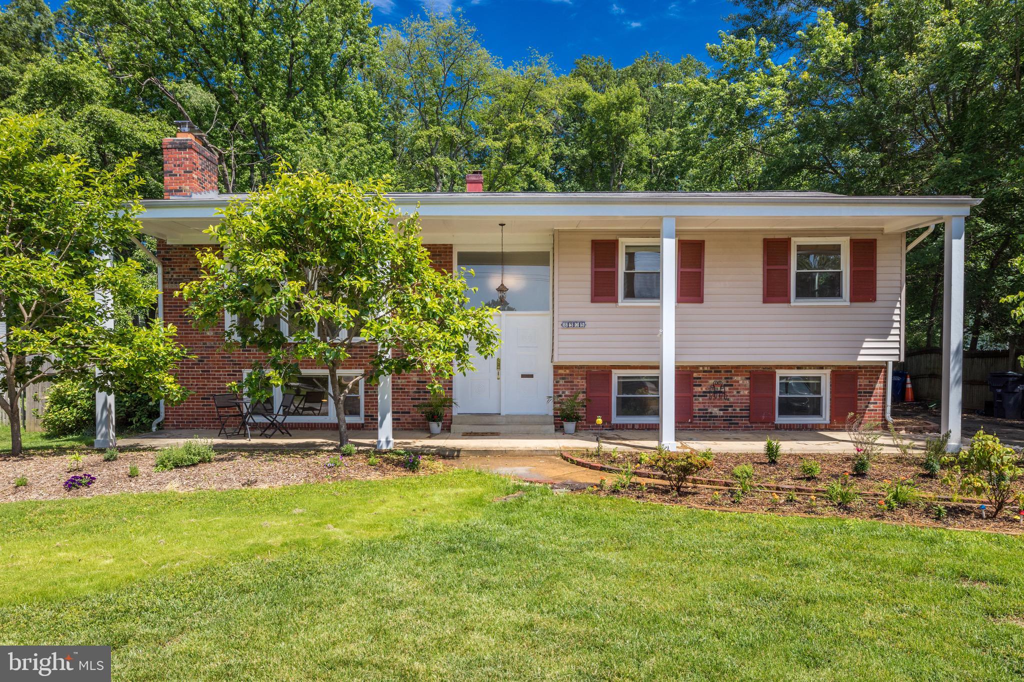 8305 Fort Hunt Road Alexandria, VA 22308 - Photo 72 of 74 a view of a house with a yard porch and sitting area